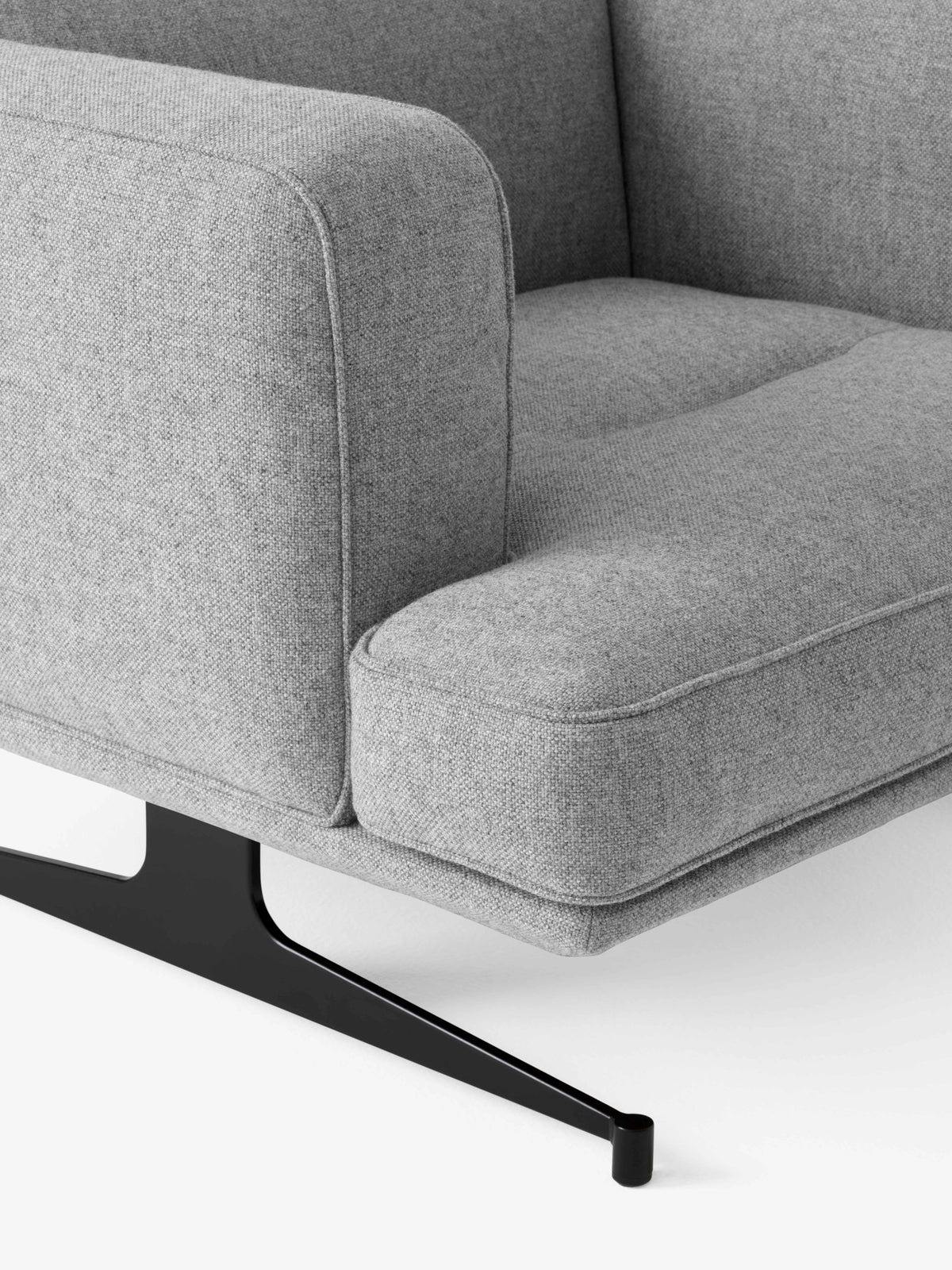 INLAND AV21 upholstered armchair with a black base