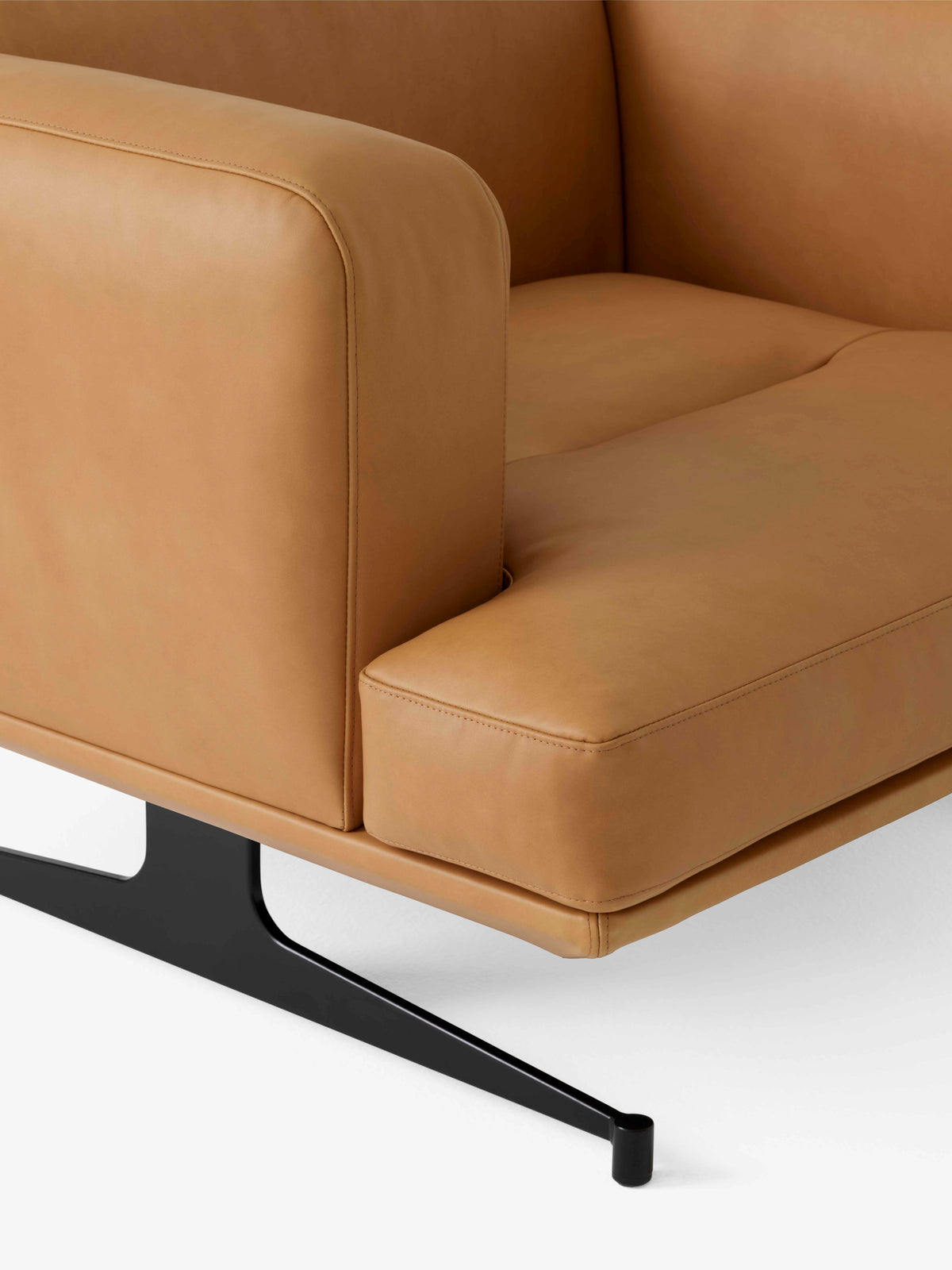INLAND AV21 upholstered armchair with a black base