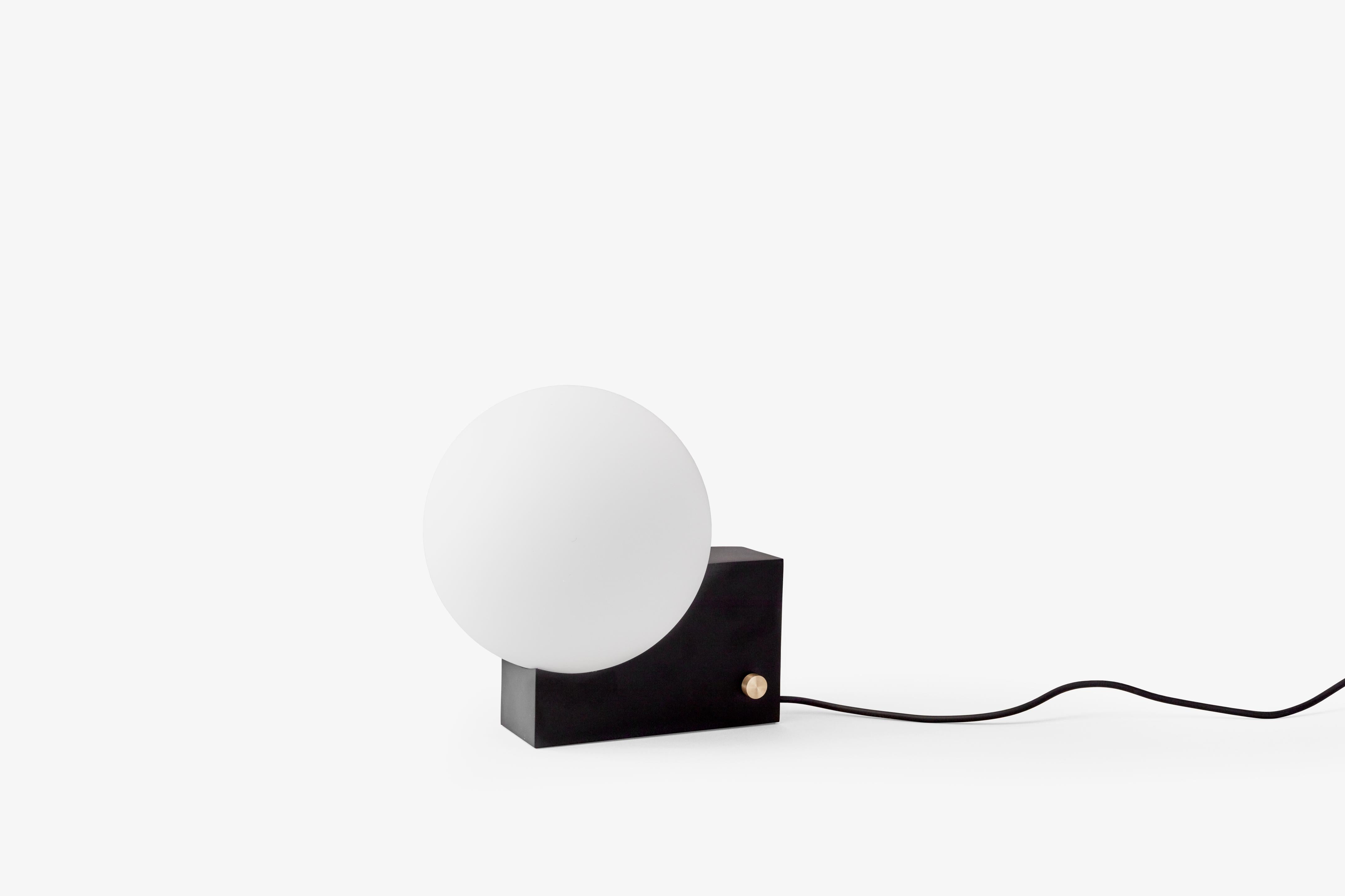JOURNEY SH1 table lamp with a milky shade and black base.
