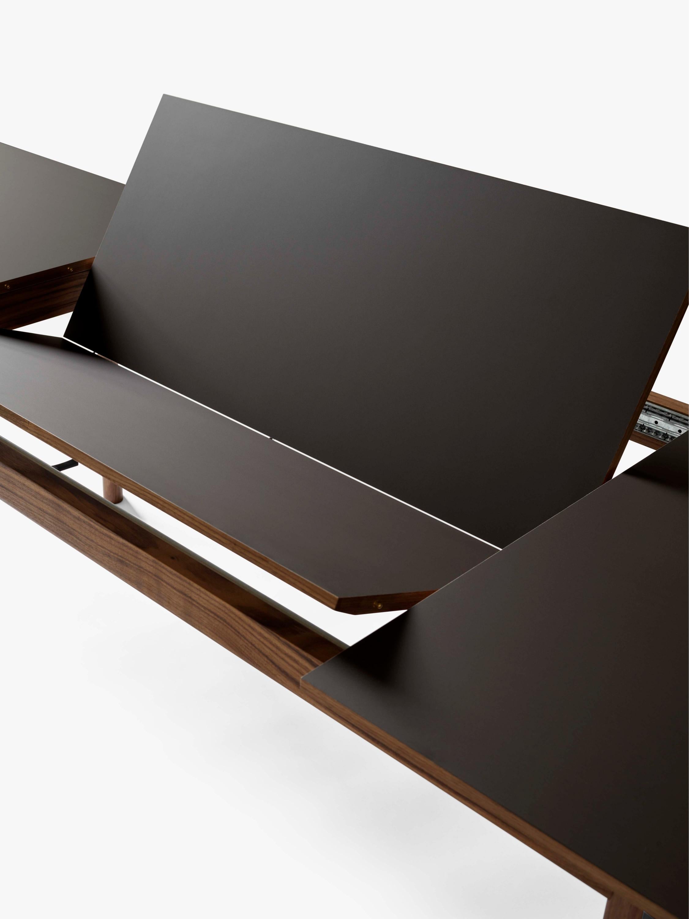 PATCH extendable table with a brown laminated top and walnut base