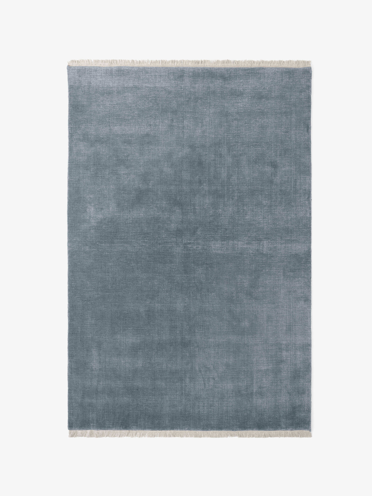 THE MOOR fringed rug in blue