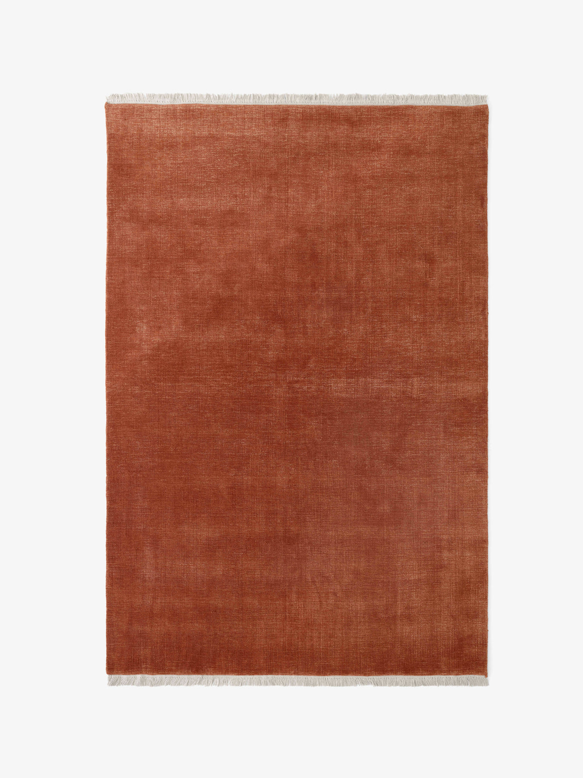 THE MOOR fringed rug in muted red