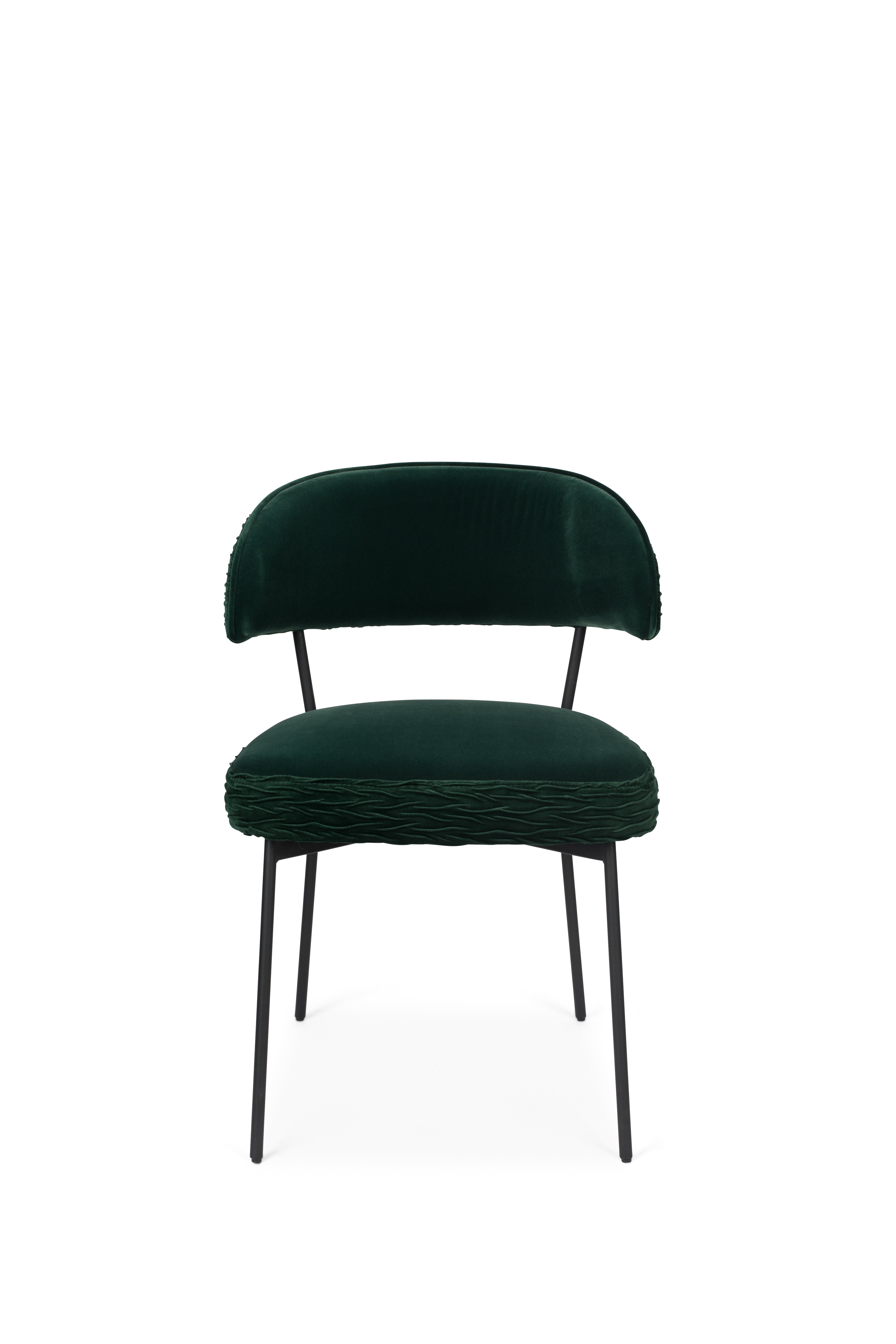 THE WINNER TAKES IT ALL chair dark green with a black base