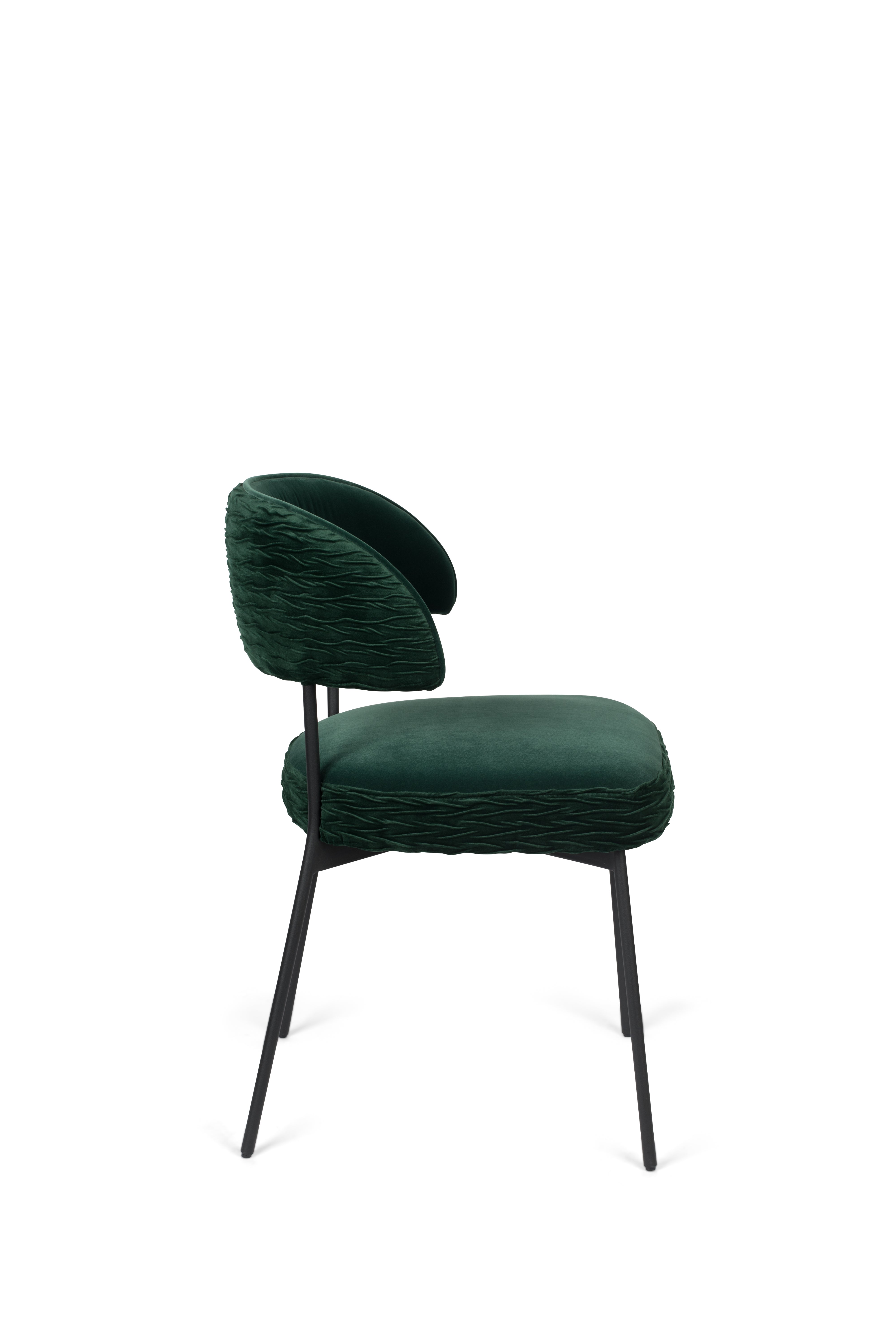 THE WINNER TAKES IT ALL chair dark green with a black base