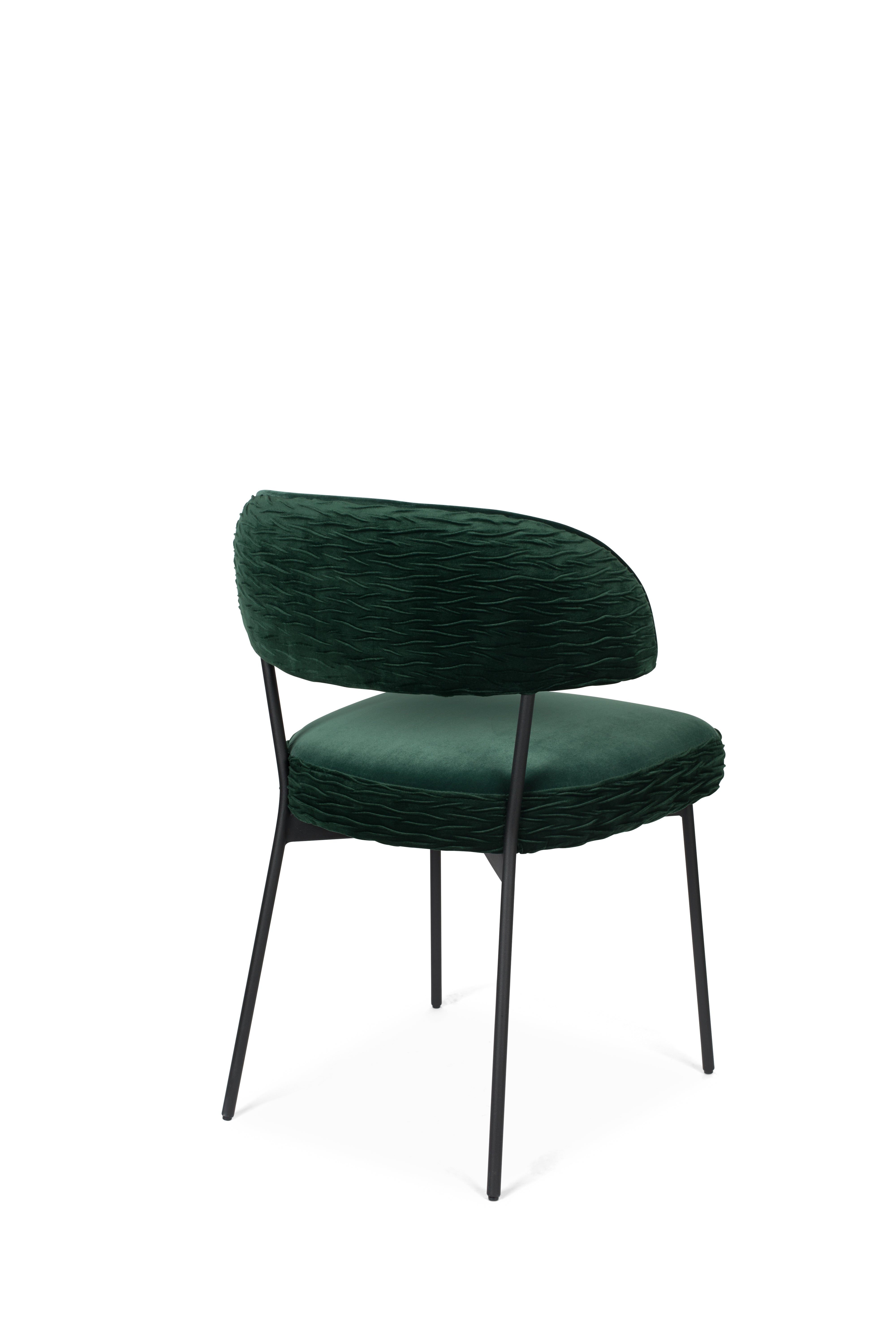 THE WINNER TAKES IT ALL chair dark green with a black base