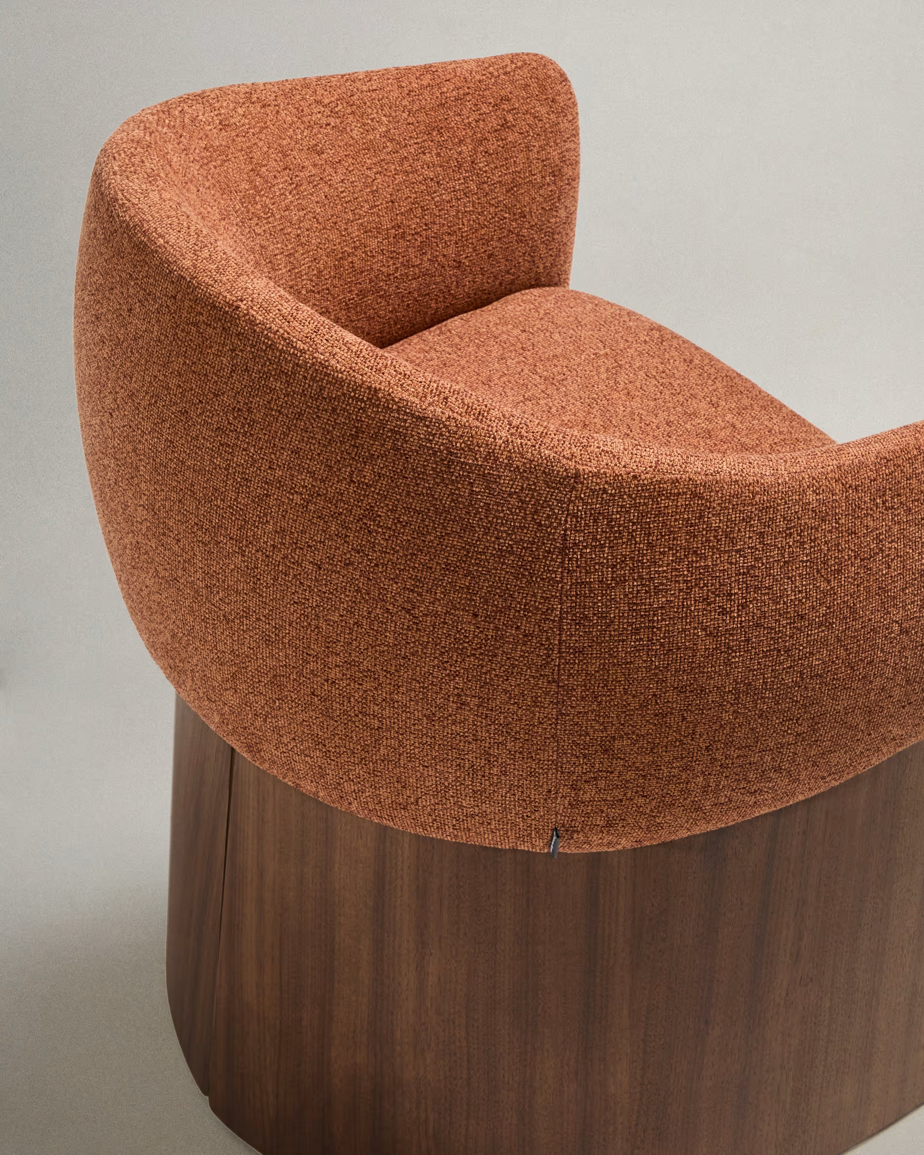 BOSCA chair in brick-colored chenille with a walnut veneer base