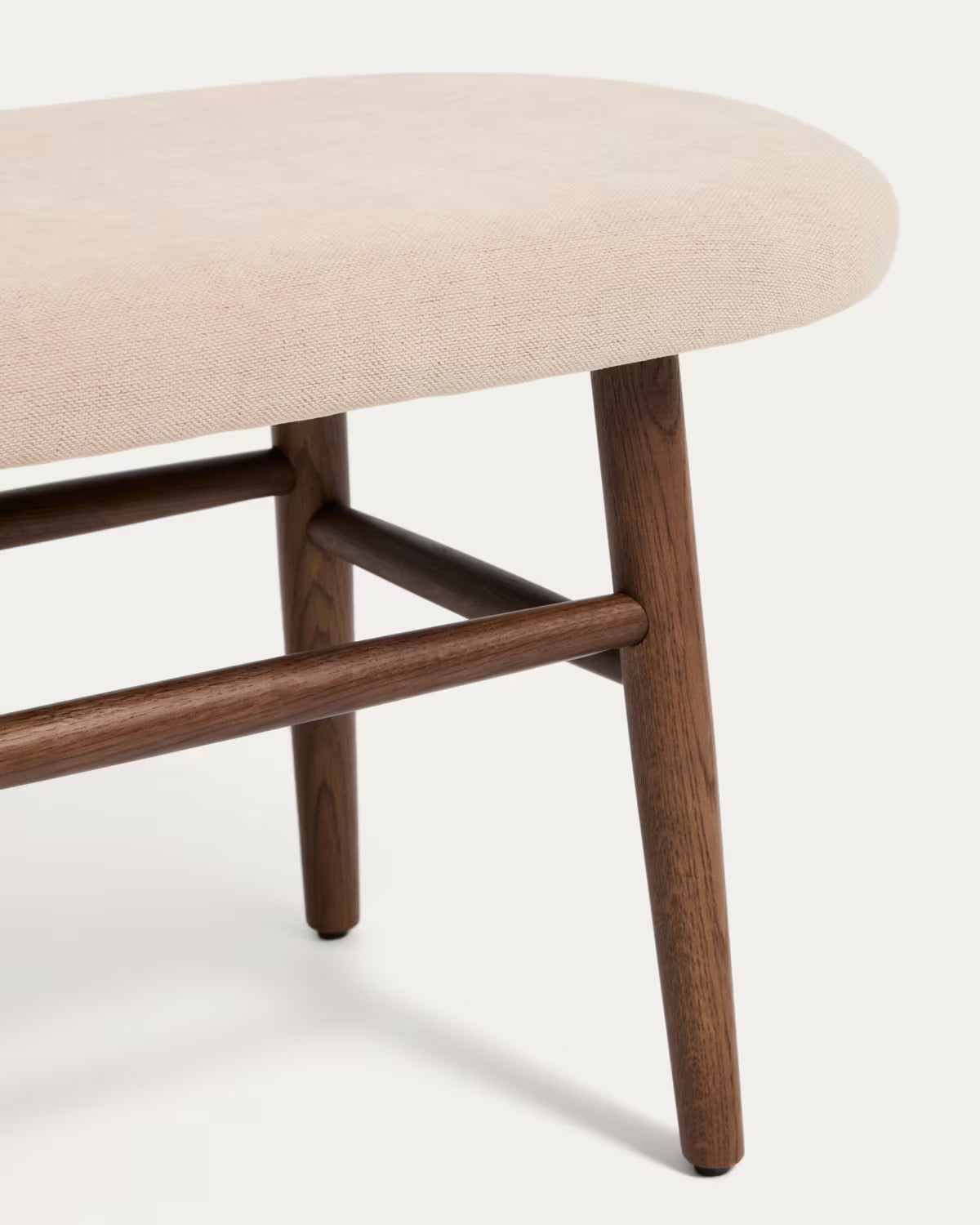 HELD bench in beige chenille with a dark veneered oak base.