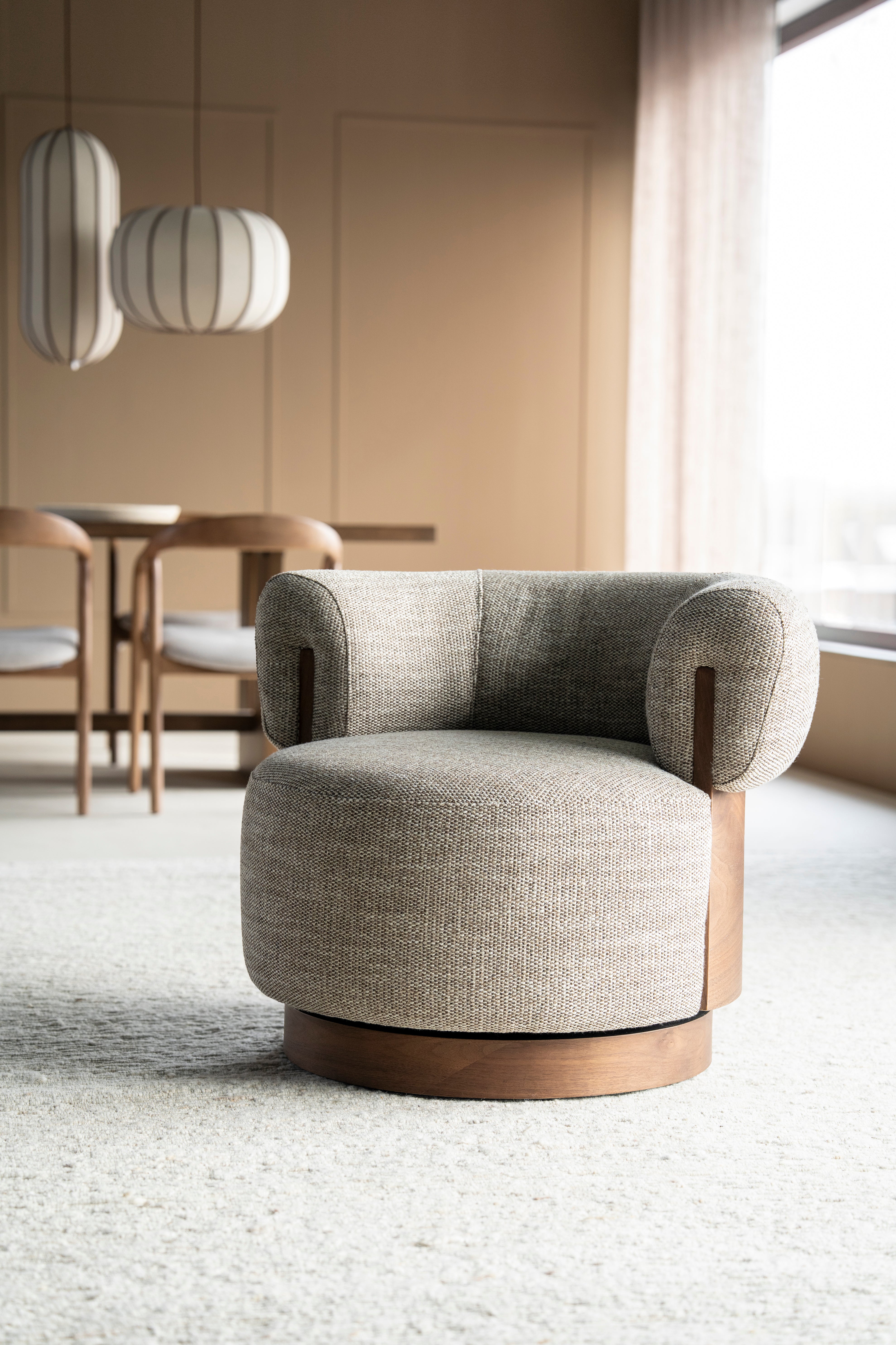 Beige swivel armchair NILA with a wooden frame