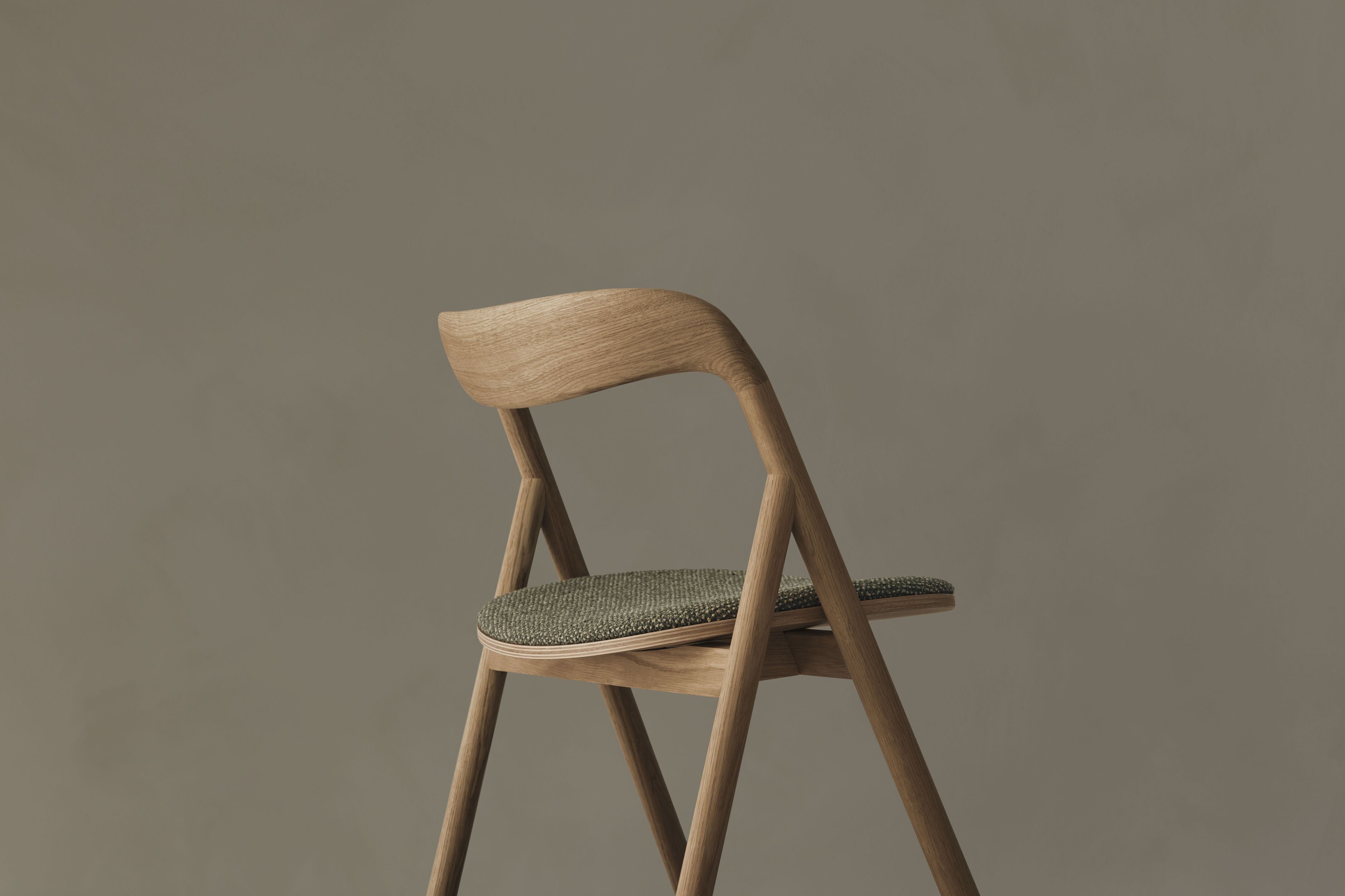 Fenri chair upholstered with a dark wooden base