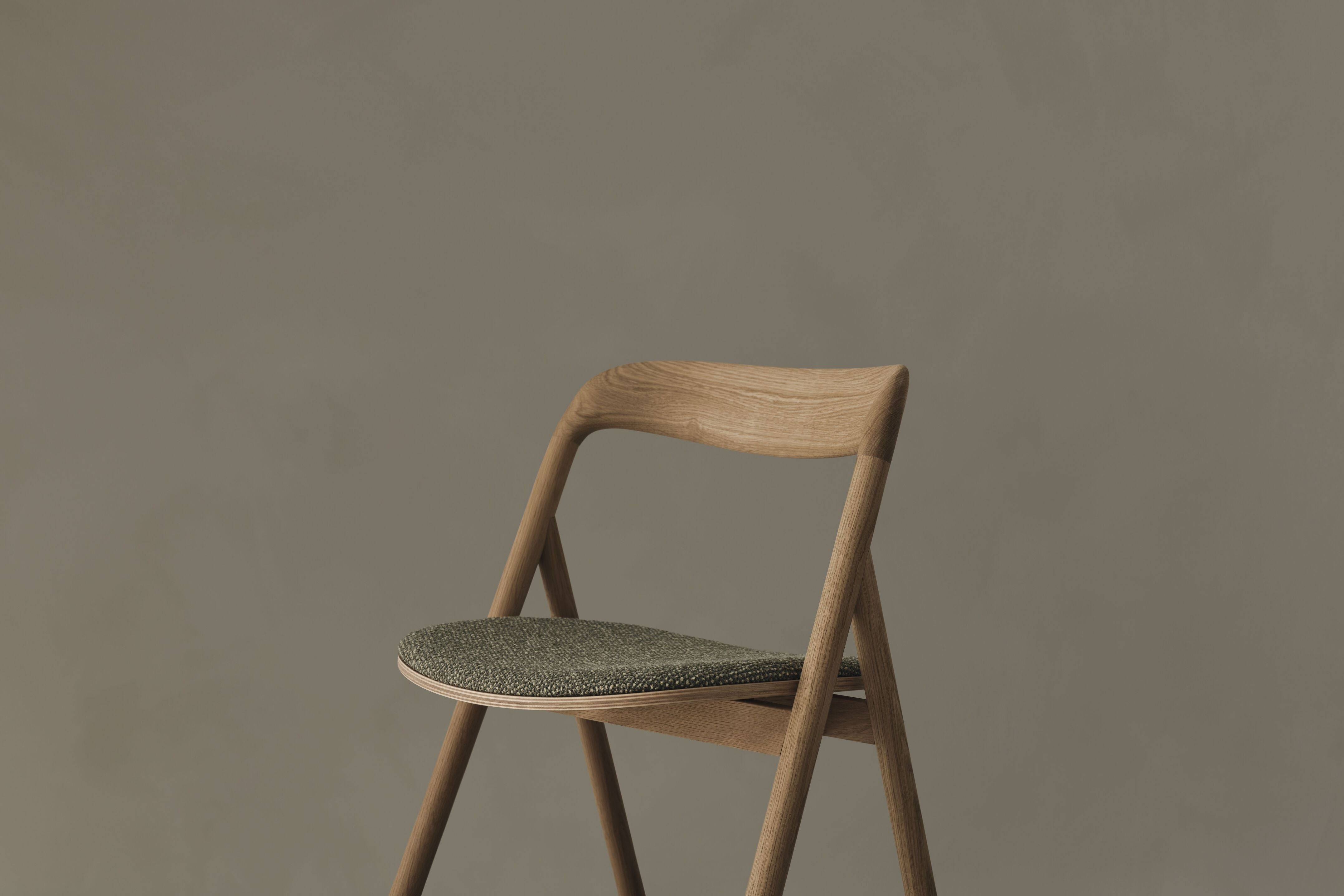 Fenri chair upholstered with a dark wooden base