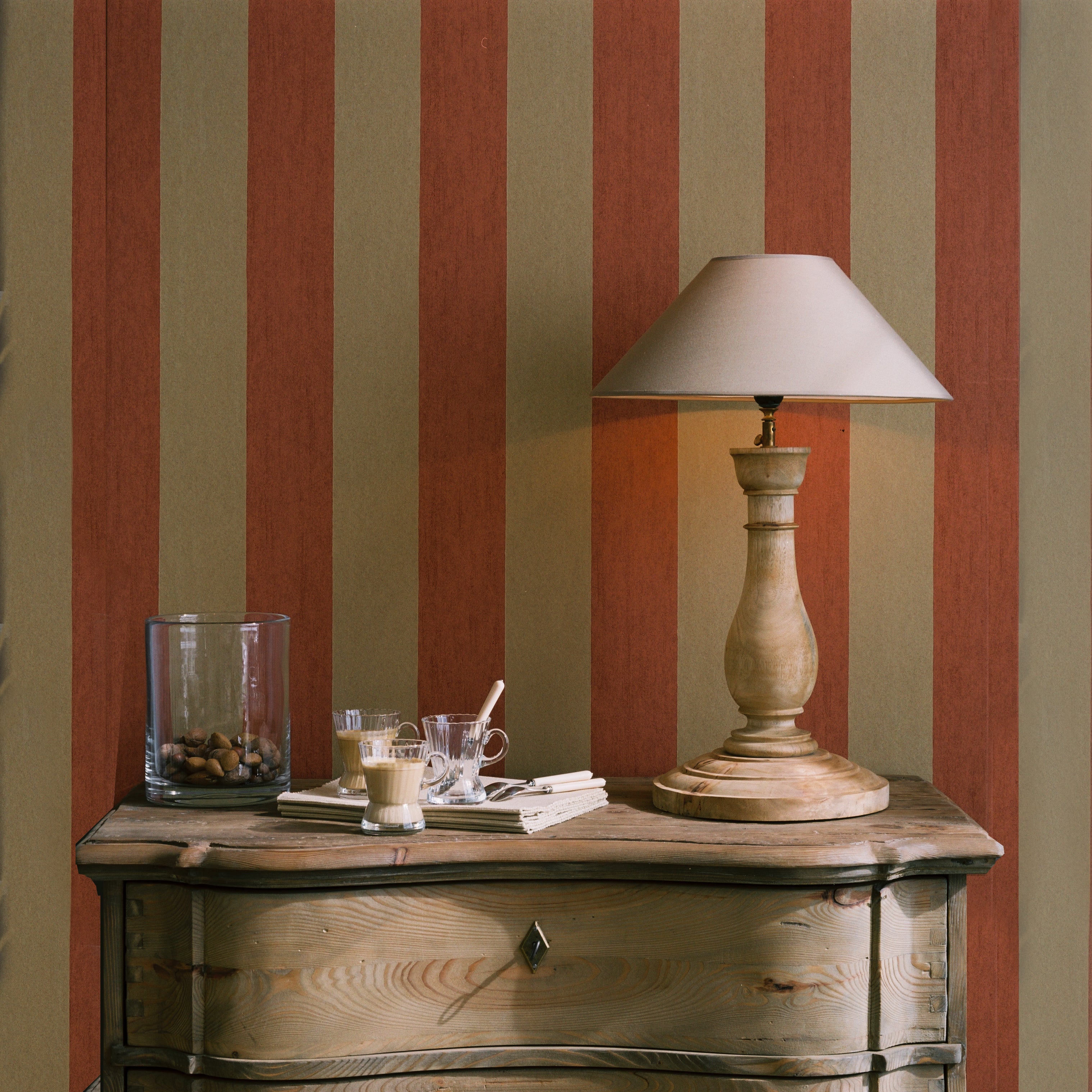 Structural wallpaper imitating canvas with a striped pattern in orange and yellow