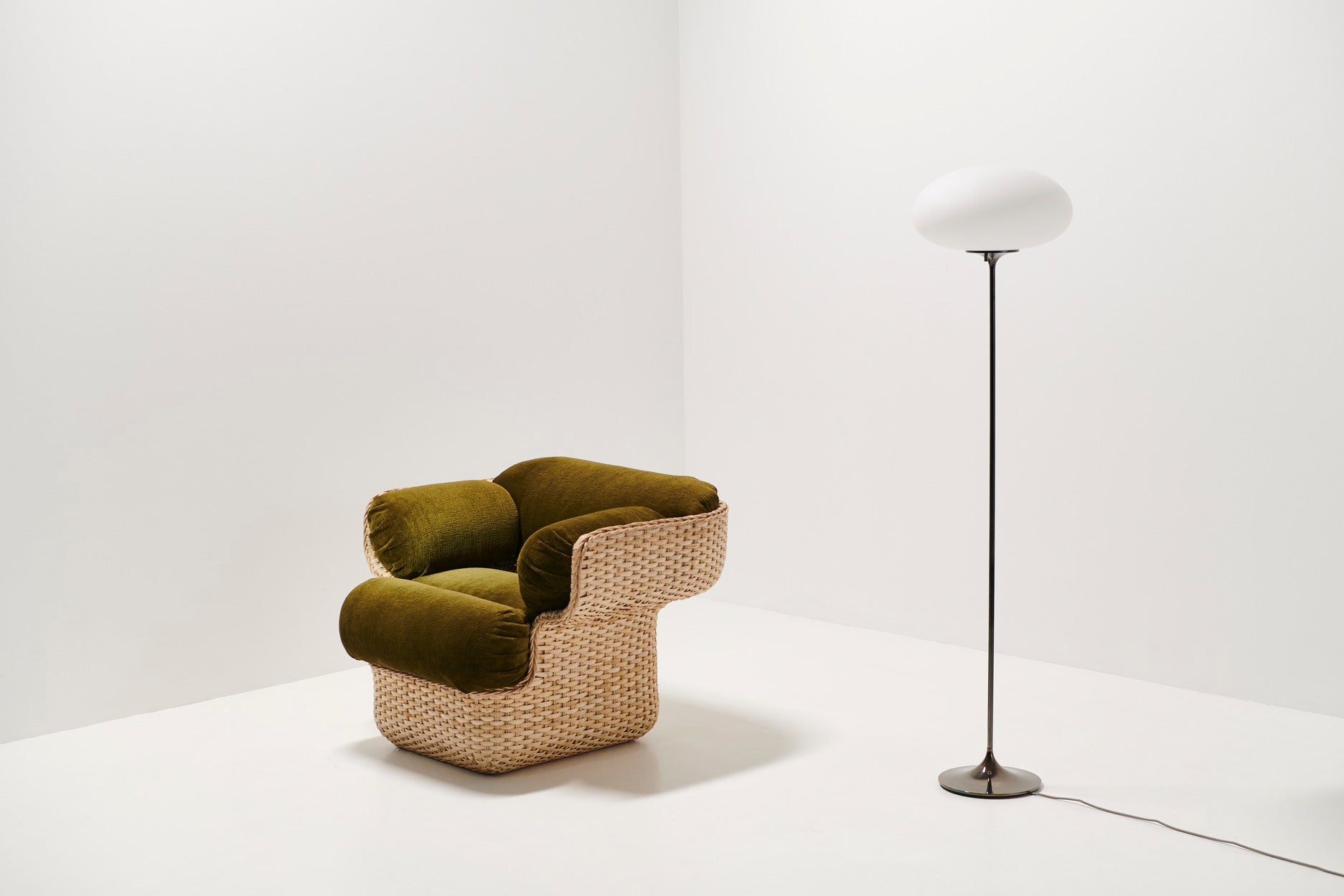 BASKET armchair in green with rattan