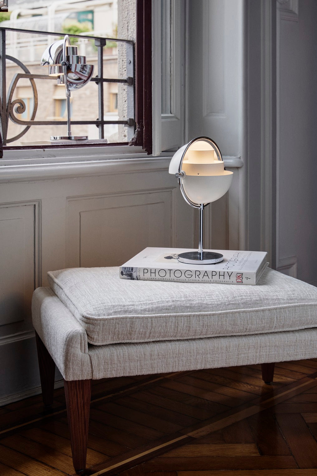 MULTI-LITE portable lamp in white with a chrome base