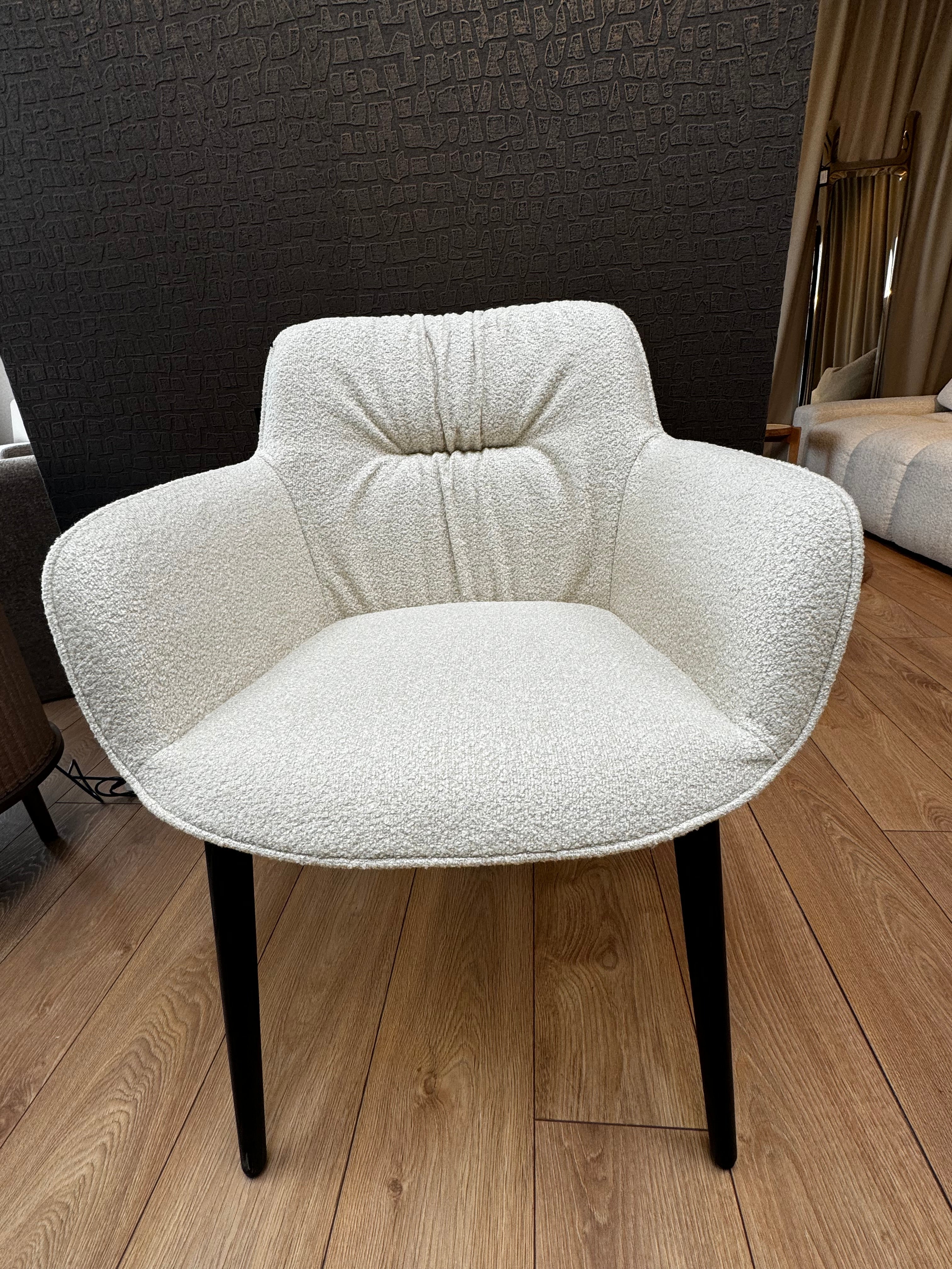 Cocoon cream chair with a black base