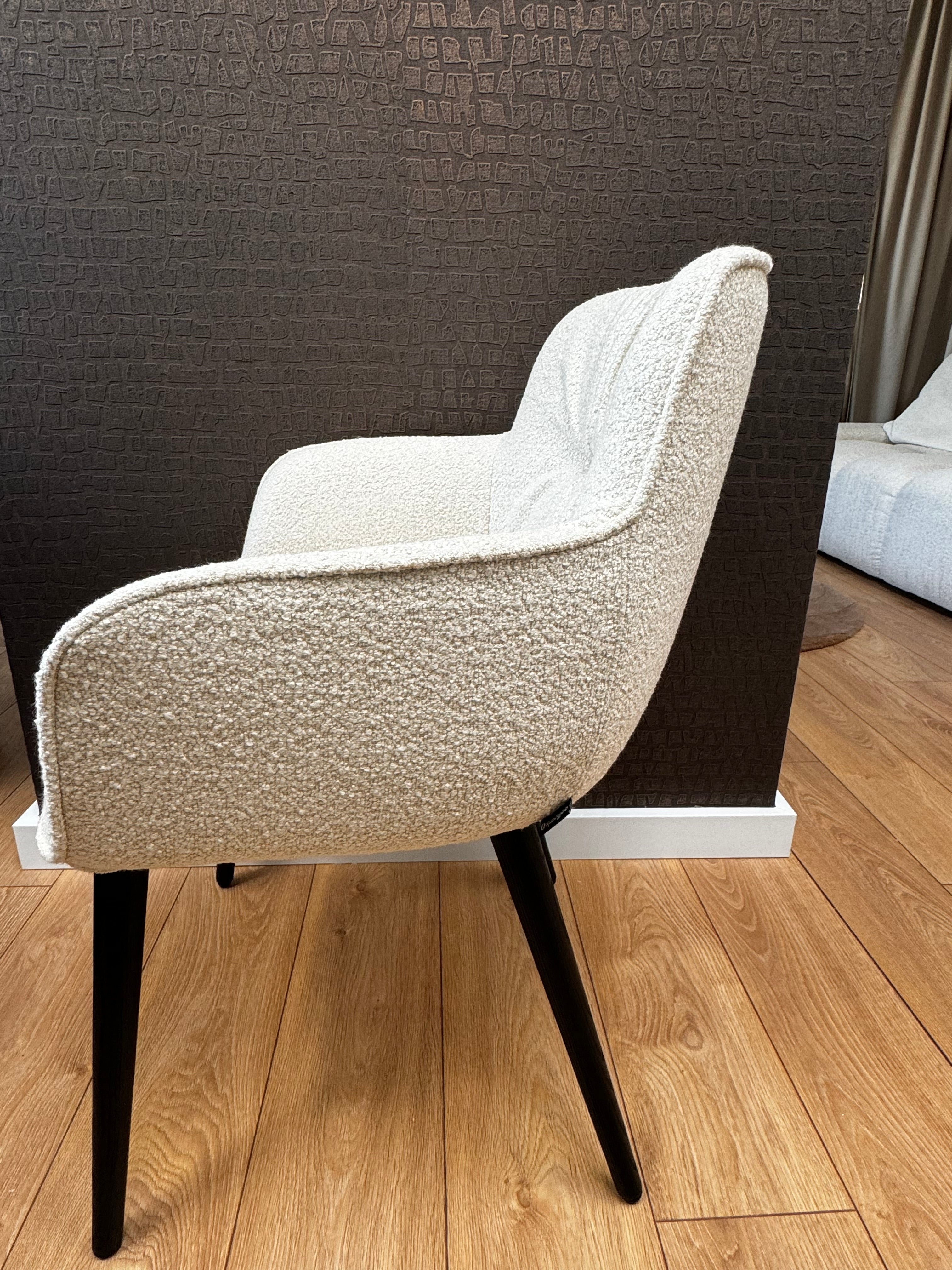 Cocoon cream chair with a black base