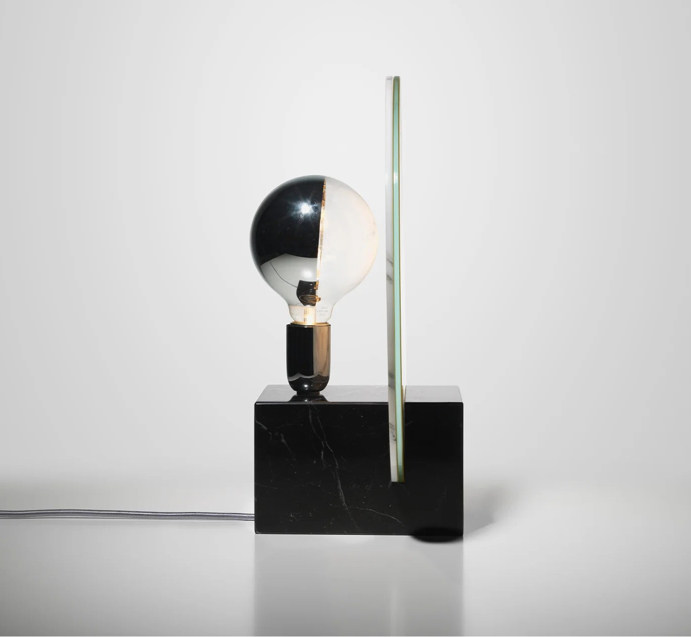 ACID MARBLE table lamp in acid yellow with a black marble base.
