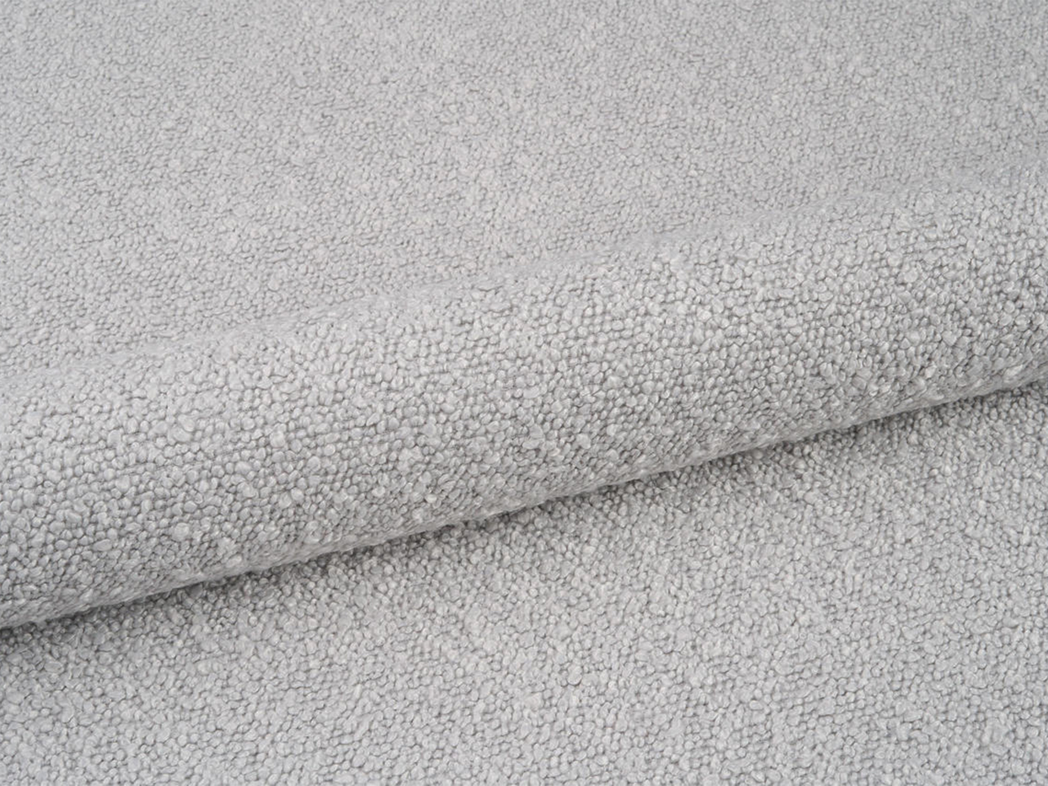 BELLIS bed with storage for bedding in light gray boucle.