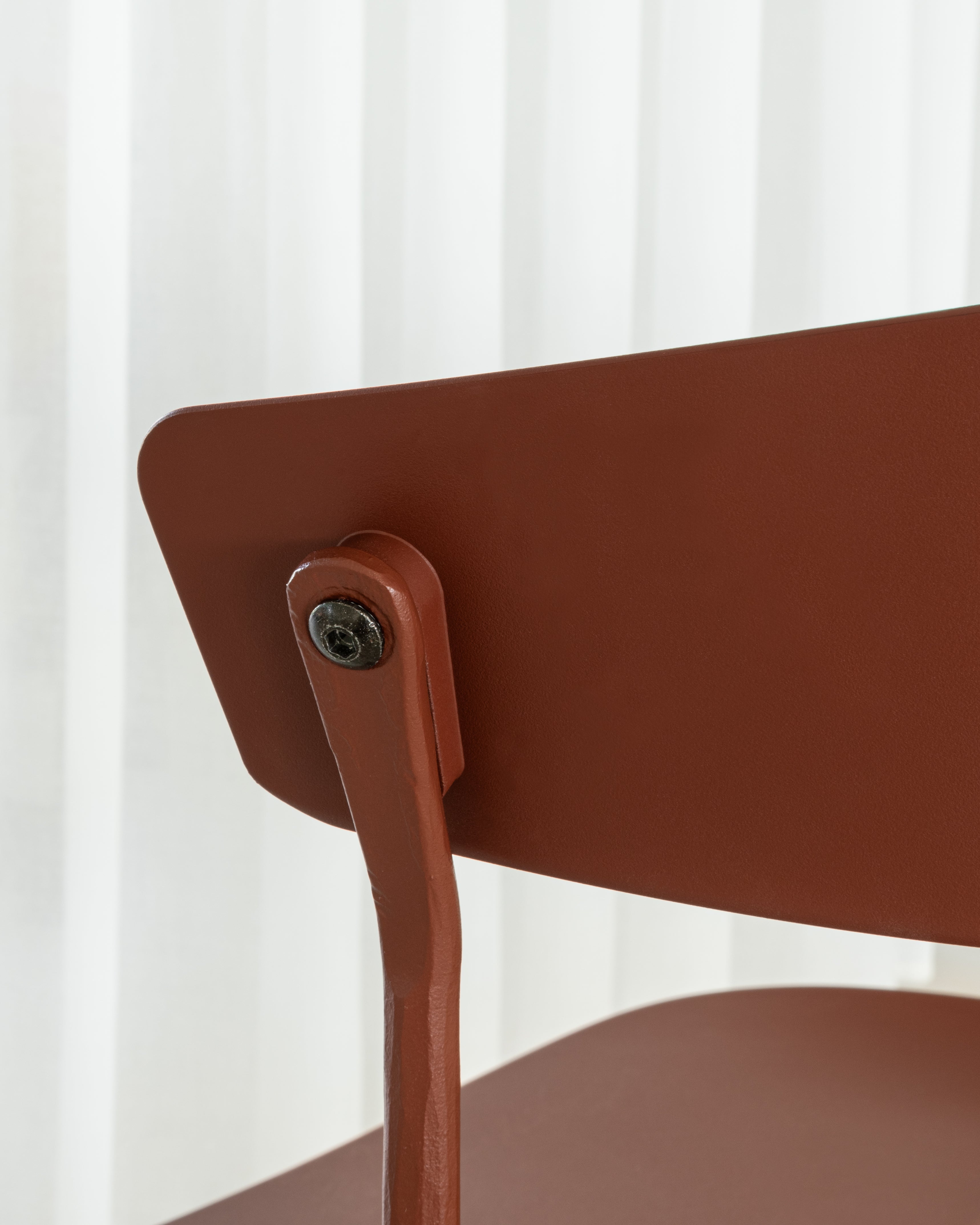 OFFICINA chair with a brown base and black seat