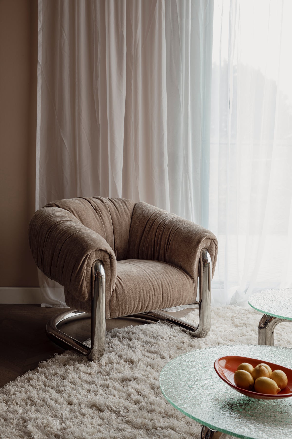 Marly armchair in beige with a steel base