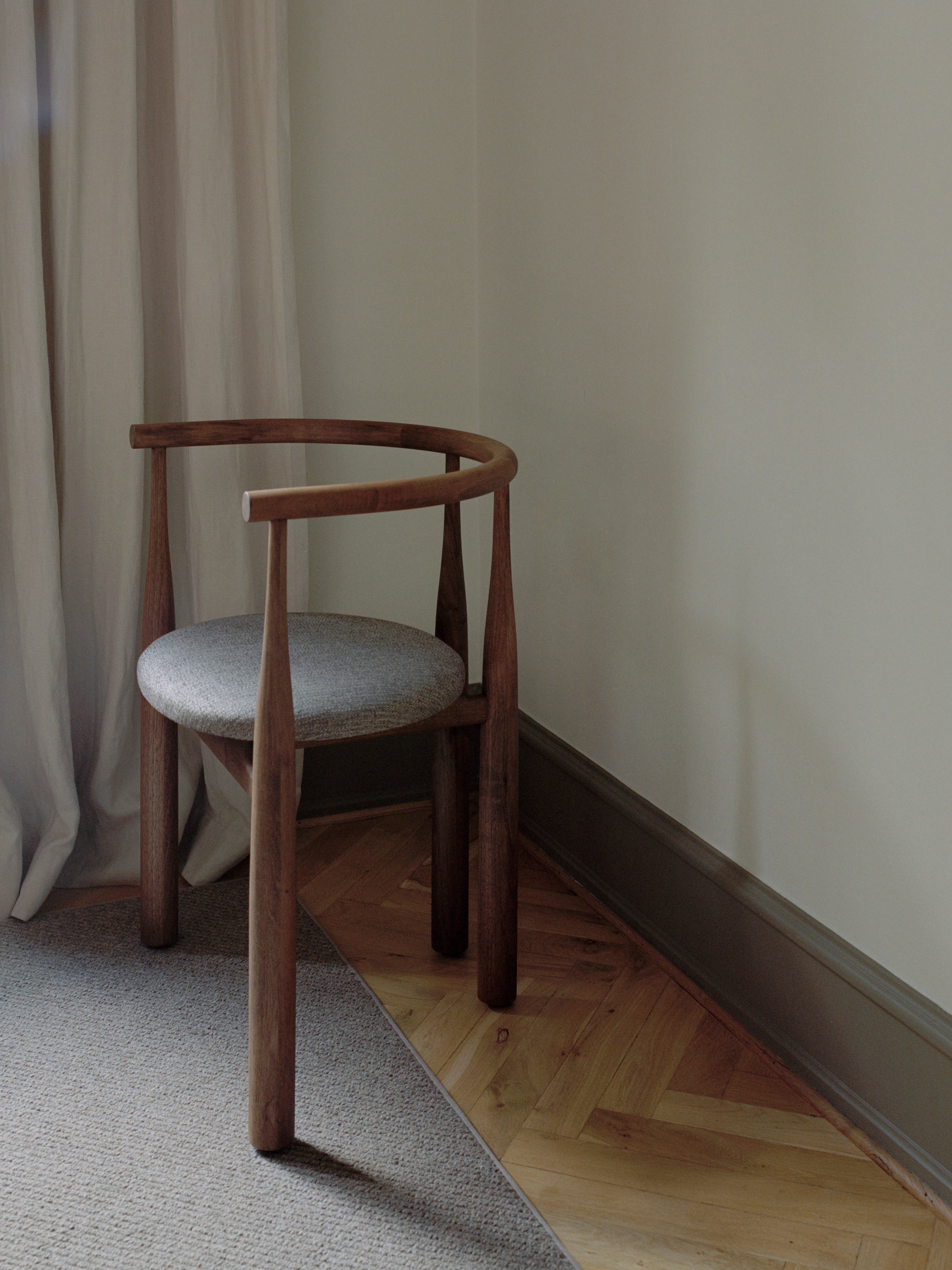 Bukowski chair upholstered with a nut base