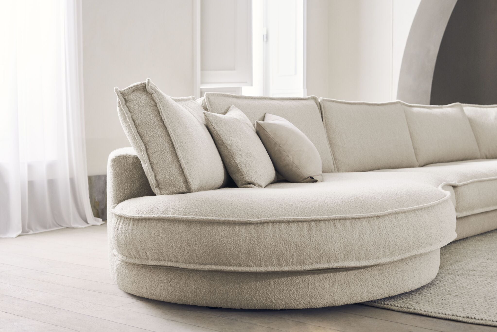 Noora modular sofa - a rounded right module with a dark base