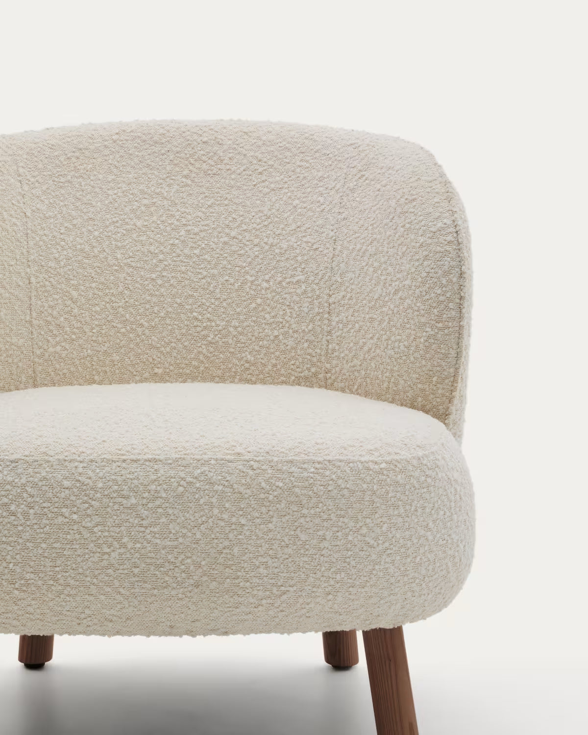 ULIT armchair in white lambswool with a dark ash base