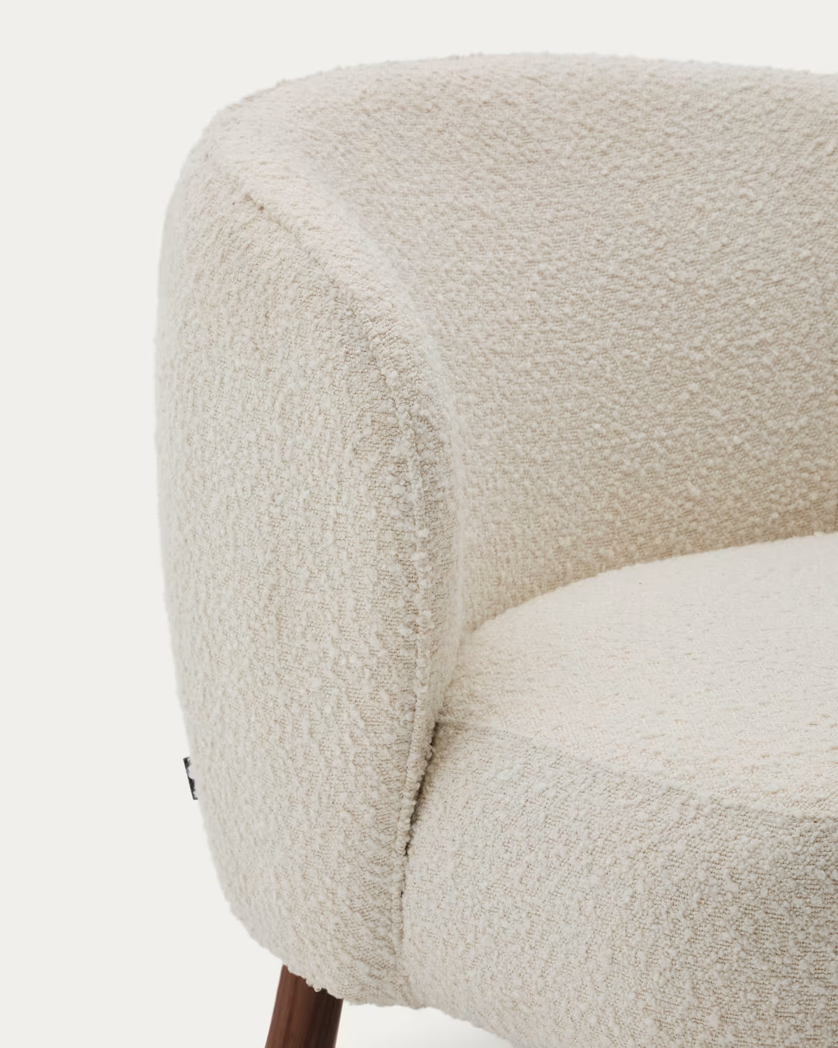 ULIT armchair in white lambswool with a dark ash base