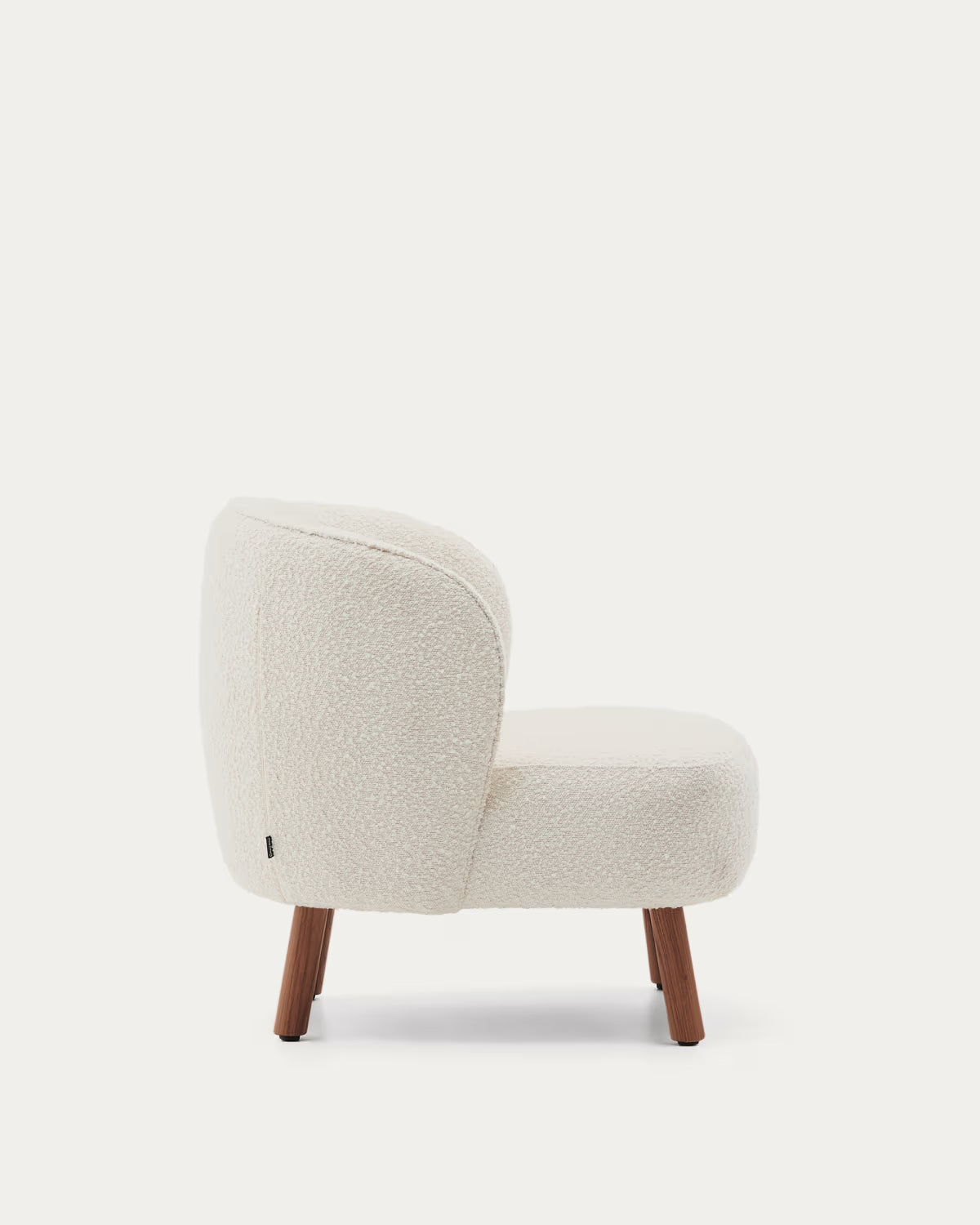 ULIT armchair in white lambswool with a dark ash base