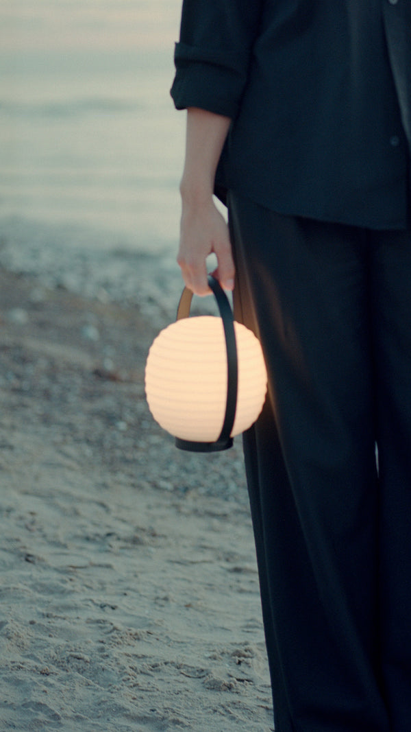 Lantern white portable lamp with a black handle