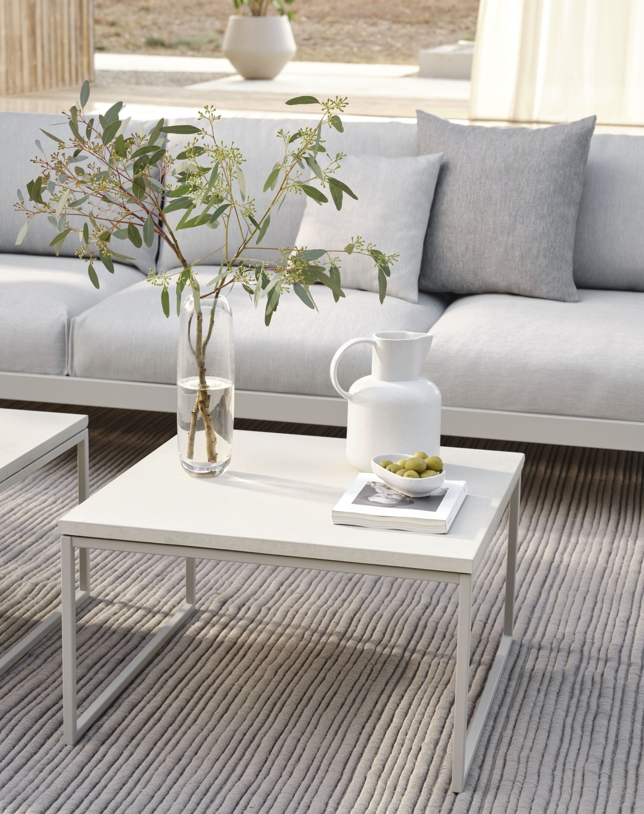 The external coffee table Como wooden top with a dark gray base