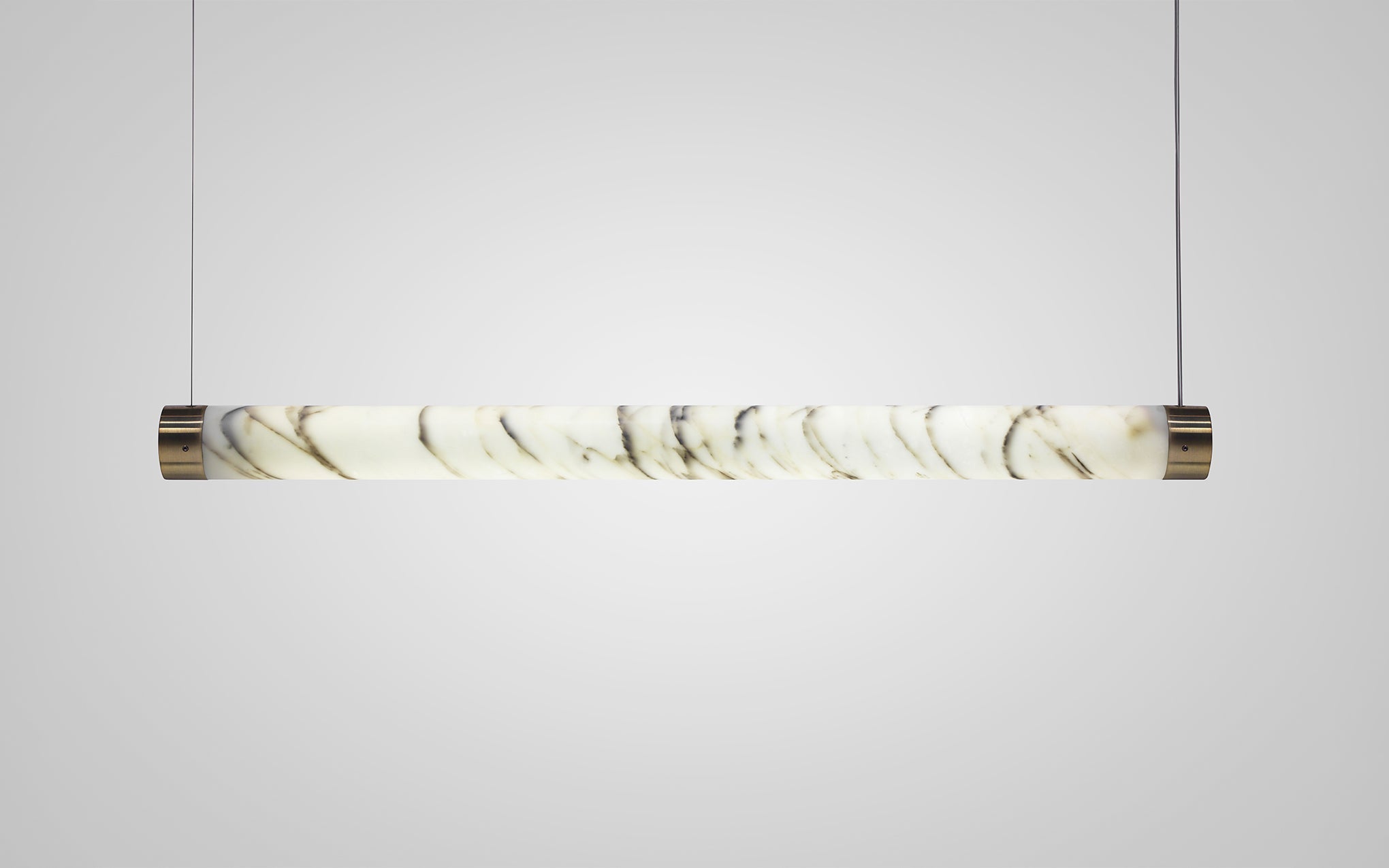 TUBE pendant lamp in marble with a brass finish
