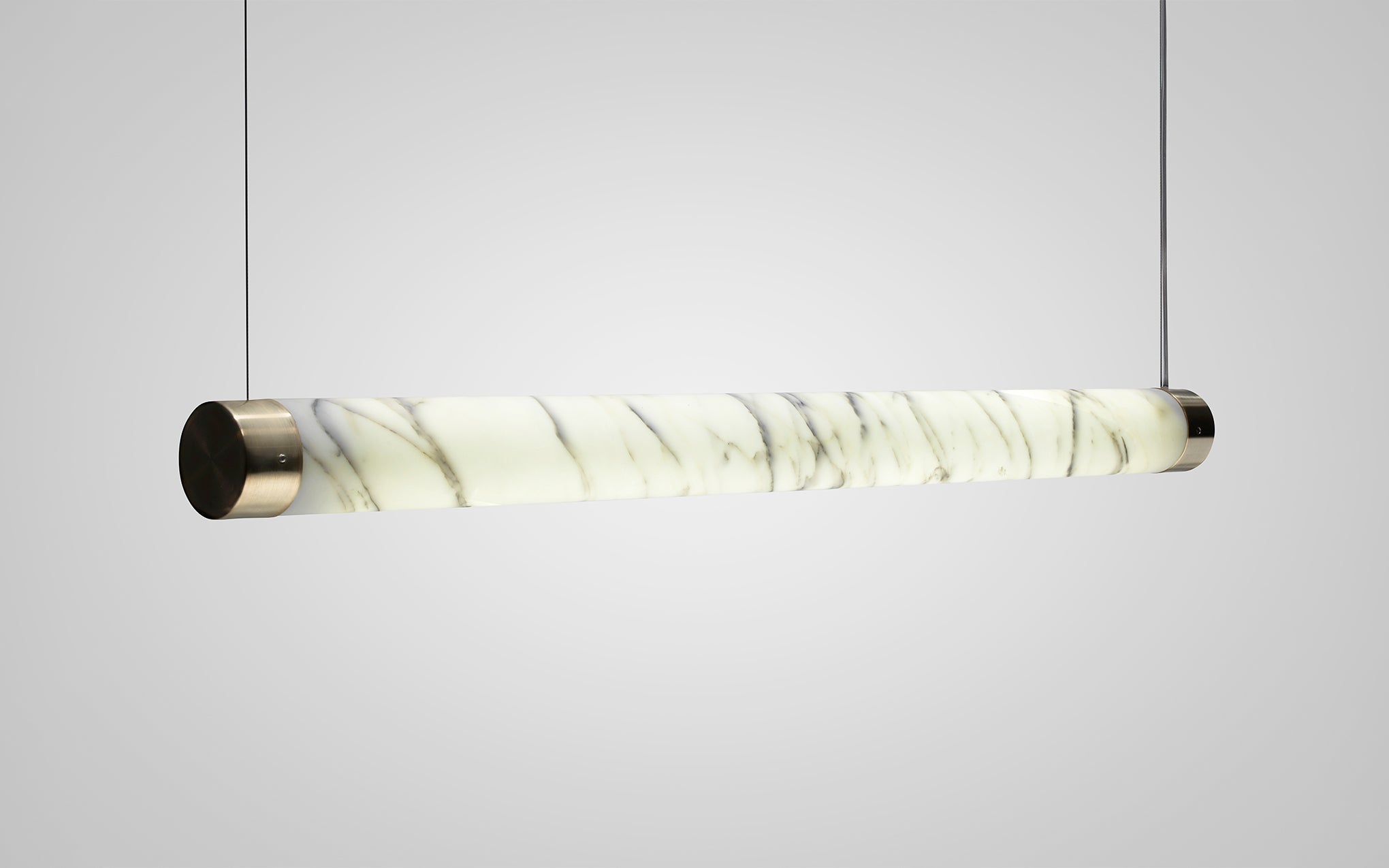 TUBE pendant lamp in marble with a brass finish