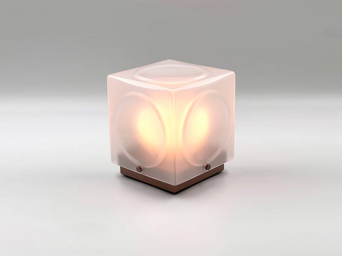 Portable lamp CHANT with a matte shade and a brown base.