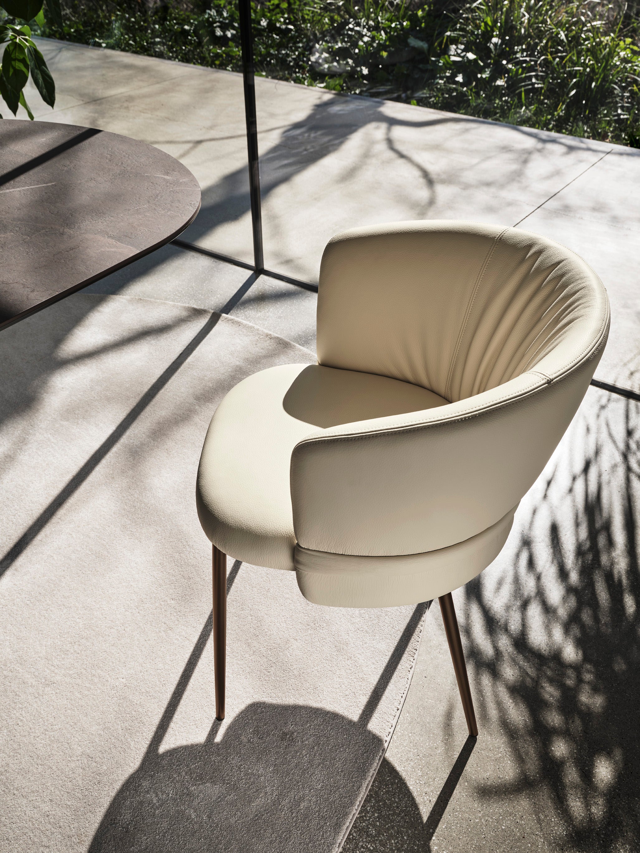 VANILLA upholstered chair with a brown metal base