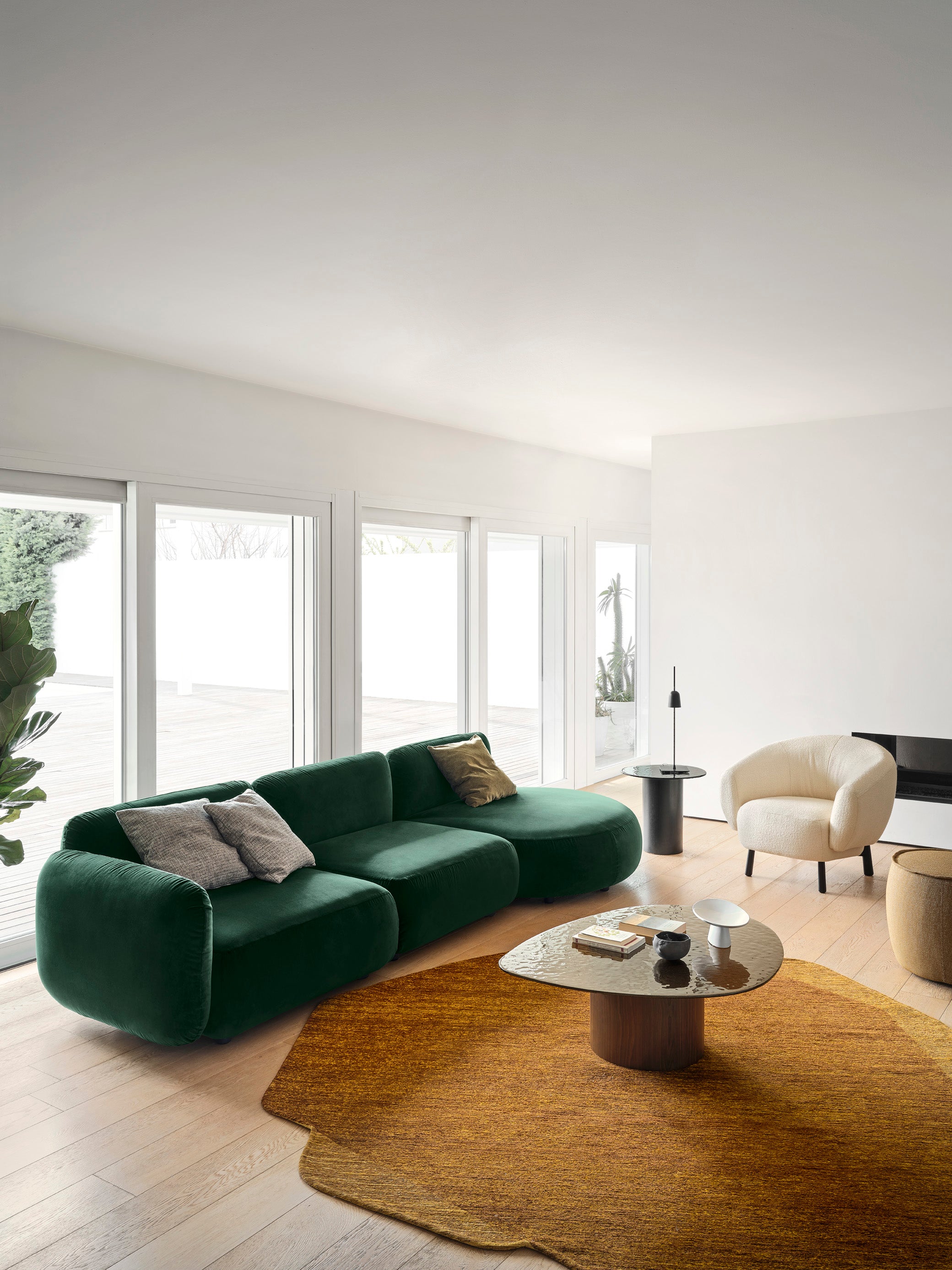 Upholstered RIO armchair with a dark wooden base