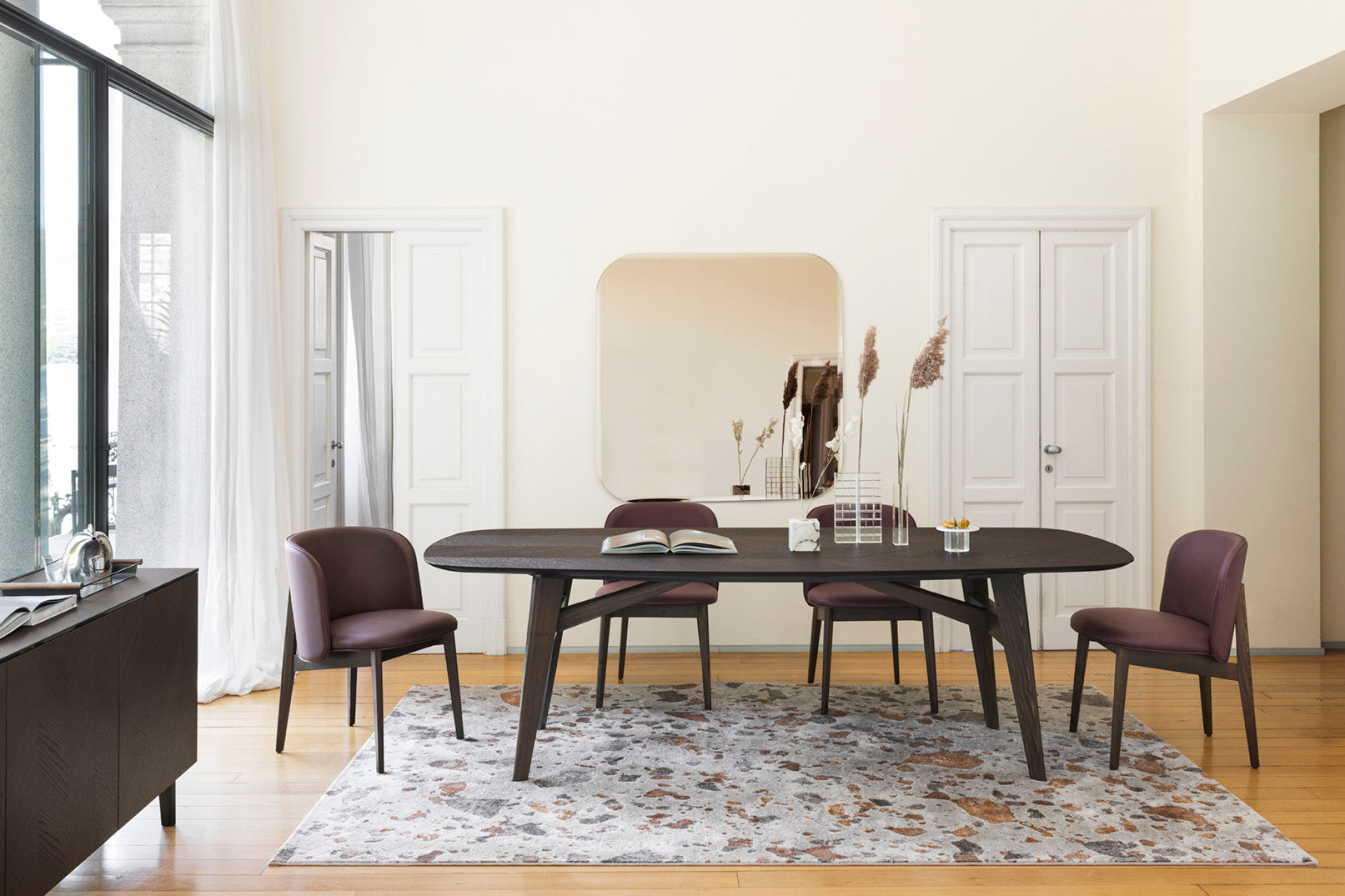ABREY upholstered chair with a dark wooden base