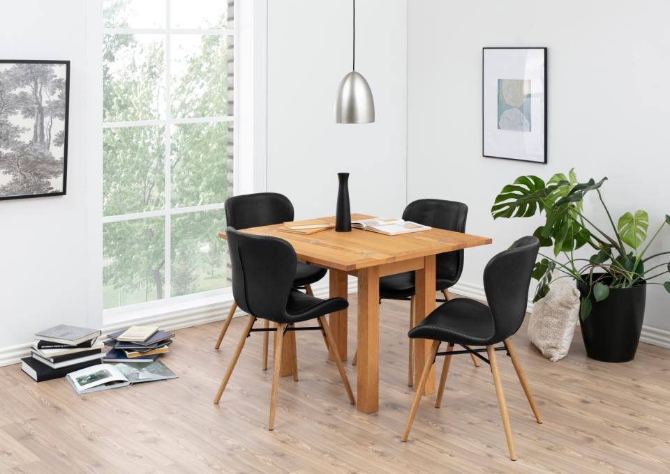 Black black leather chair with a bright base