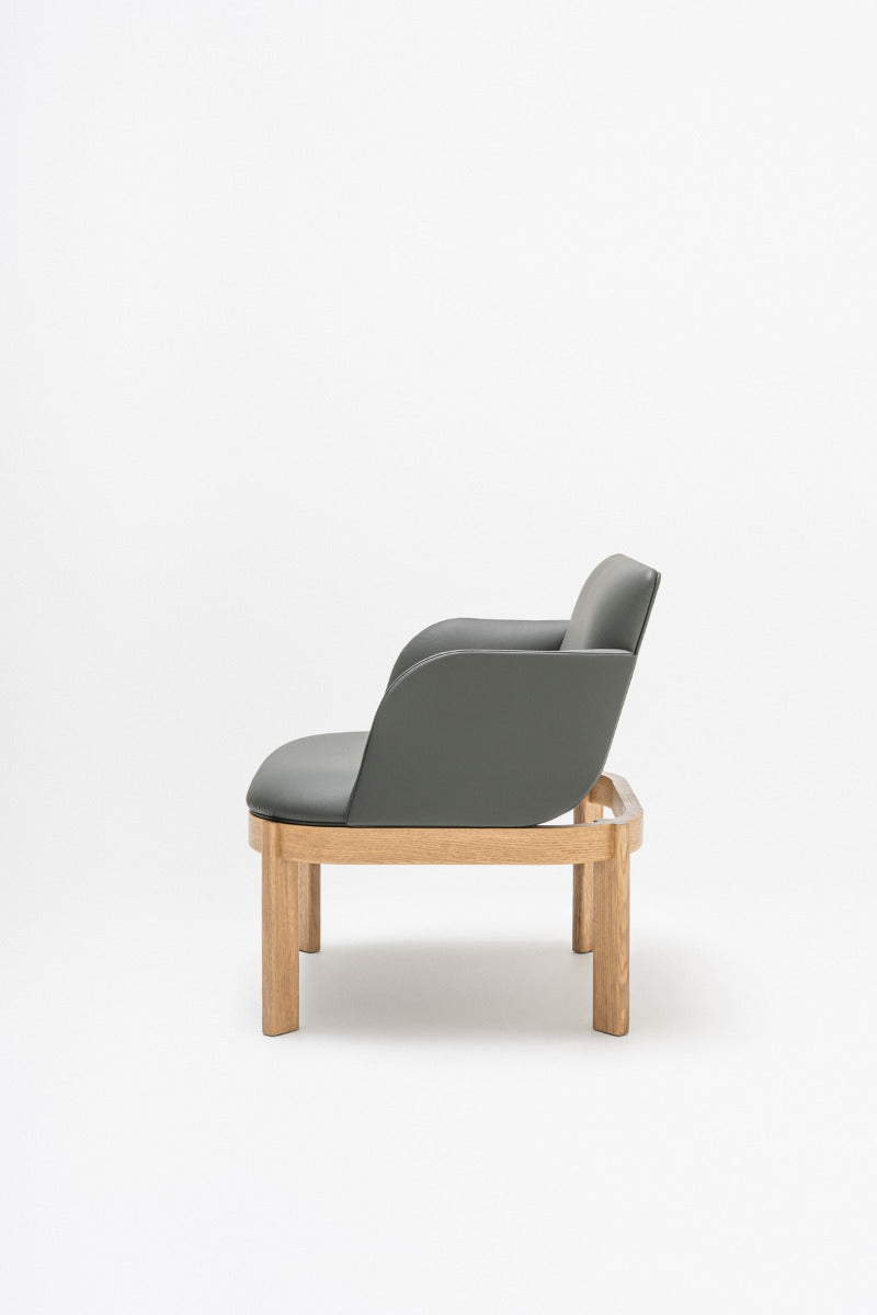 Upholstered chair of the ramp, wooden base