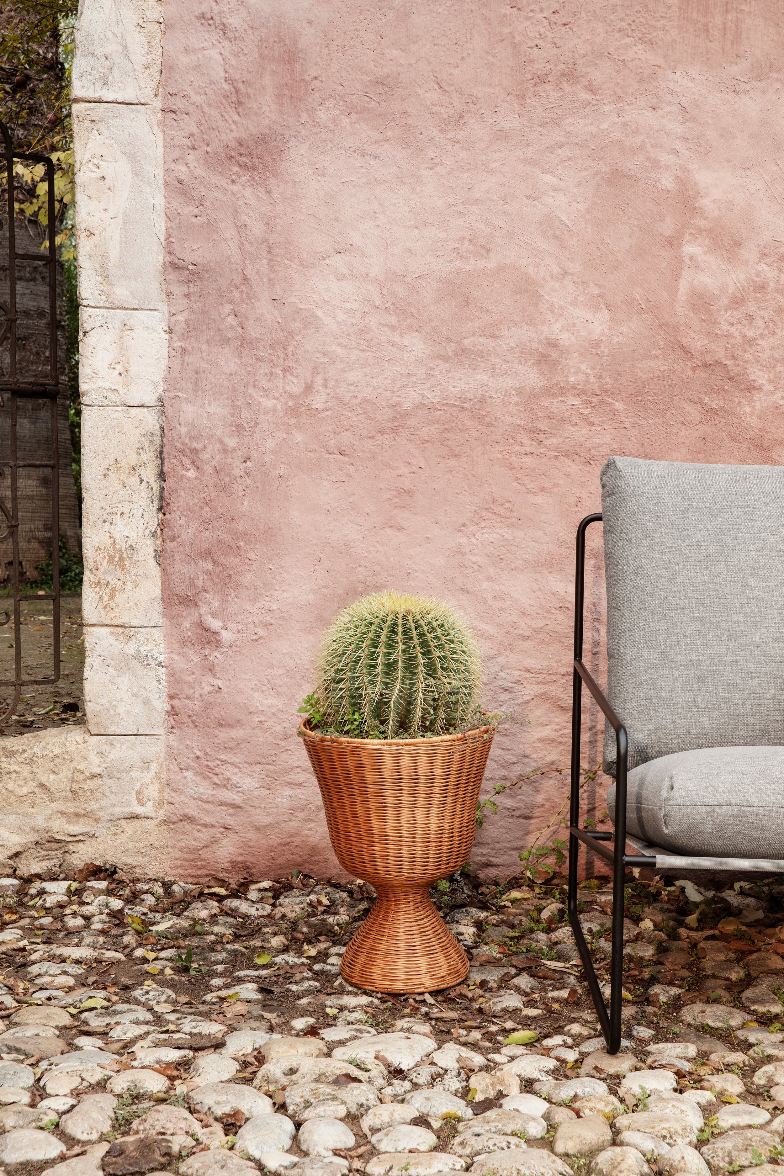 Desert beige external armchair with a black base