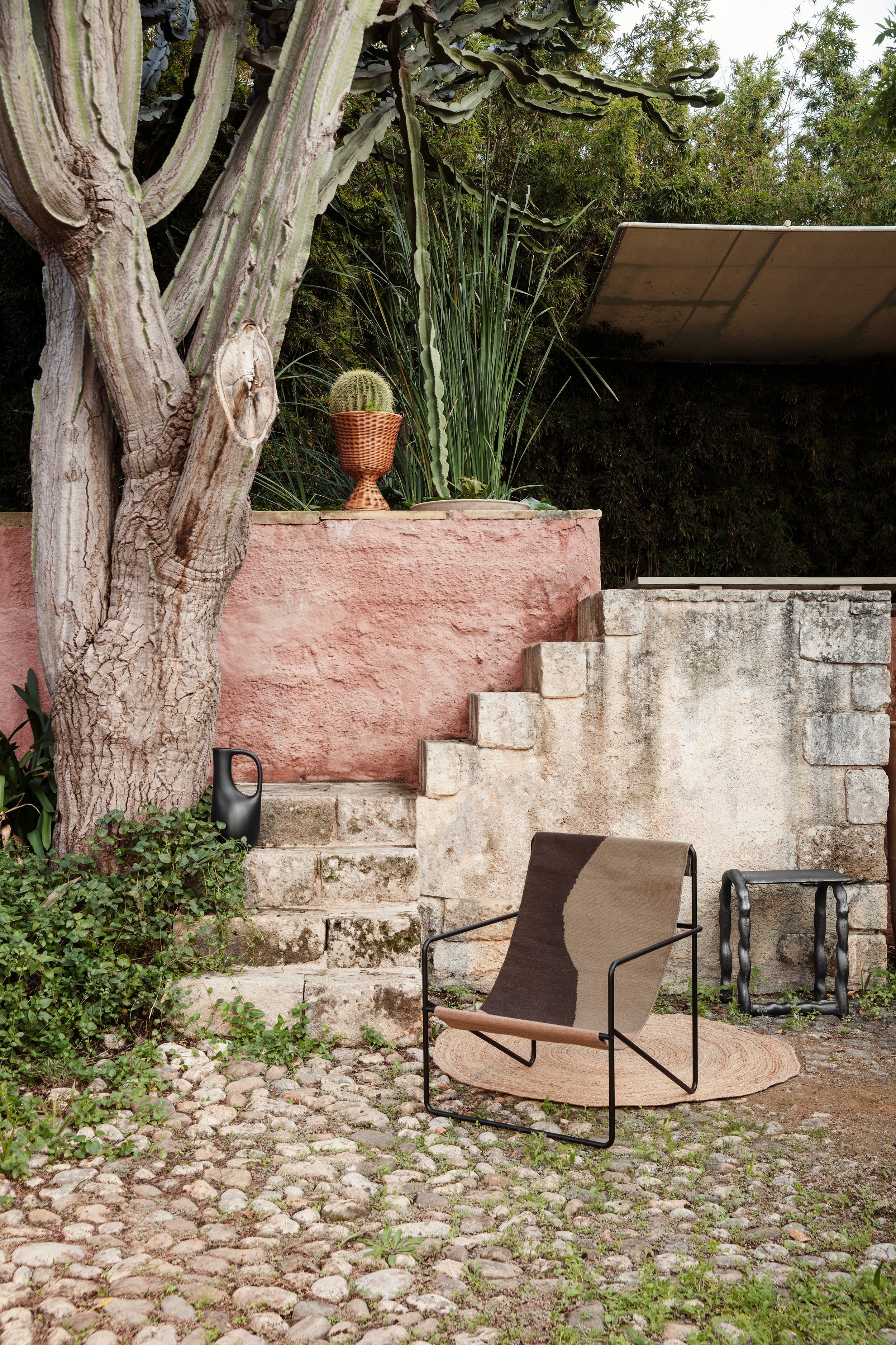 Desert olive-brown garden armchair with a black base