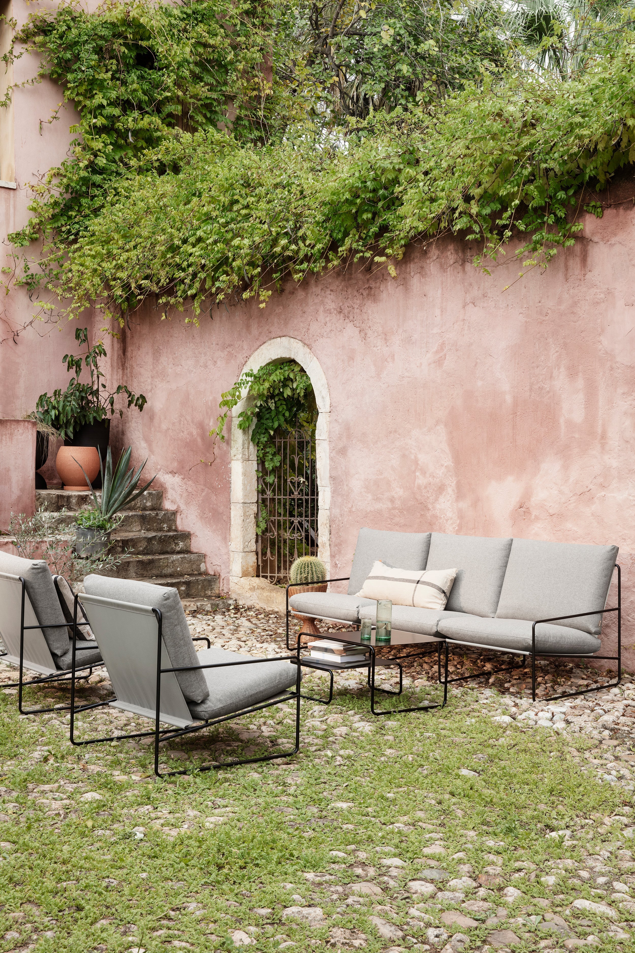 Desert beige external armchair with a black base