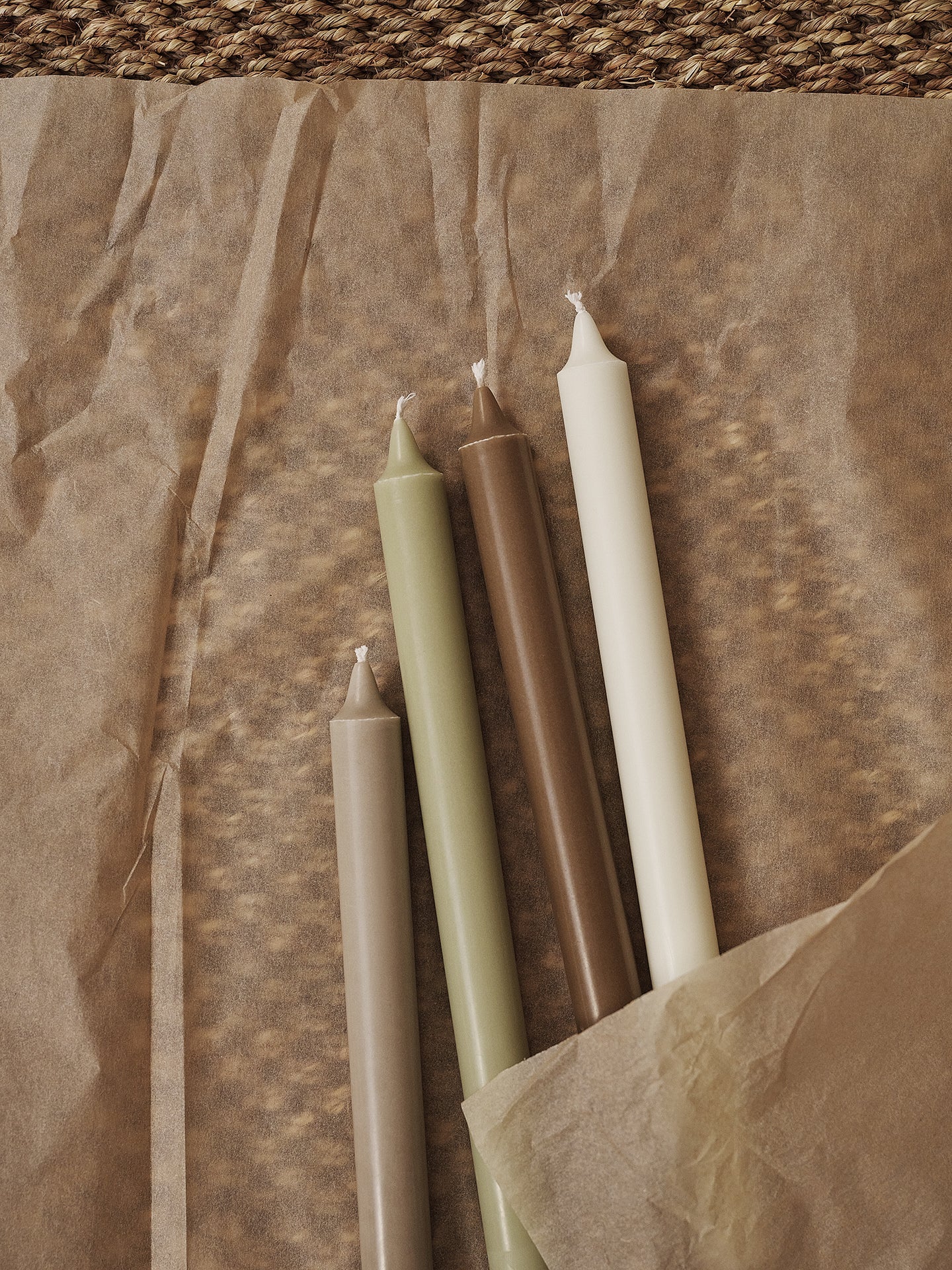 A set of green candles with beige