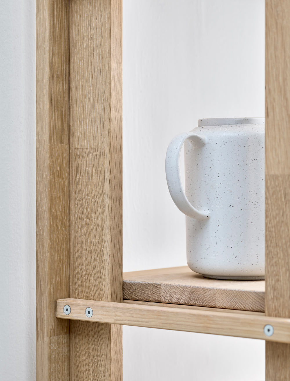 A shelf with friedman drawers bleached oak wood