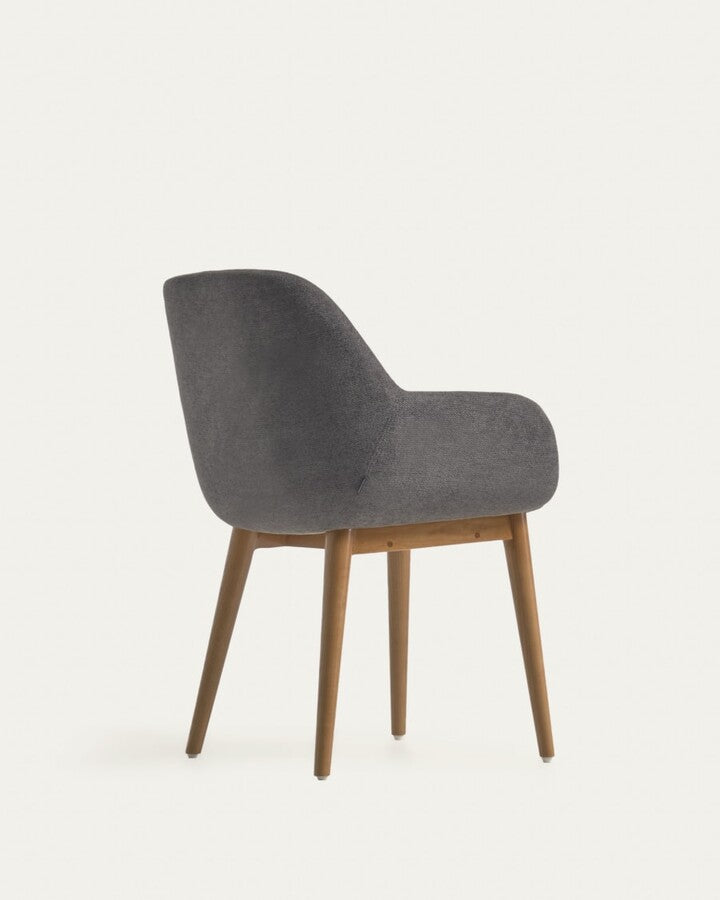 A chair in a dark gray carrier with ash base