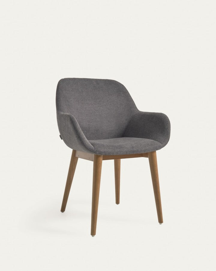 A chair in a dark gray carrier with ash base