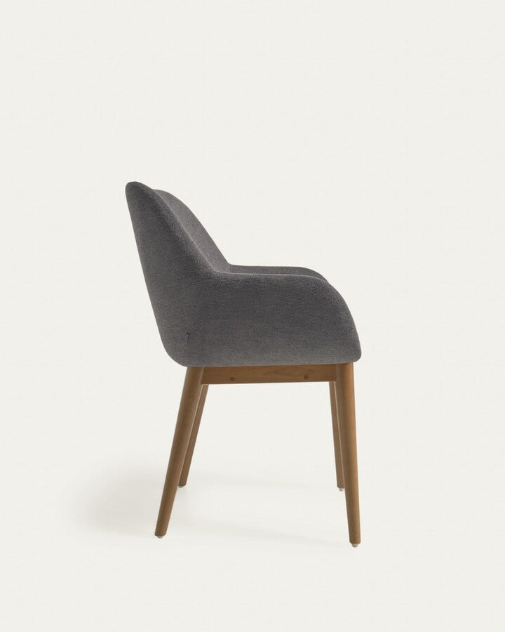 A chair in a dark gray carrier with ash base