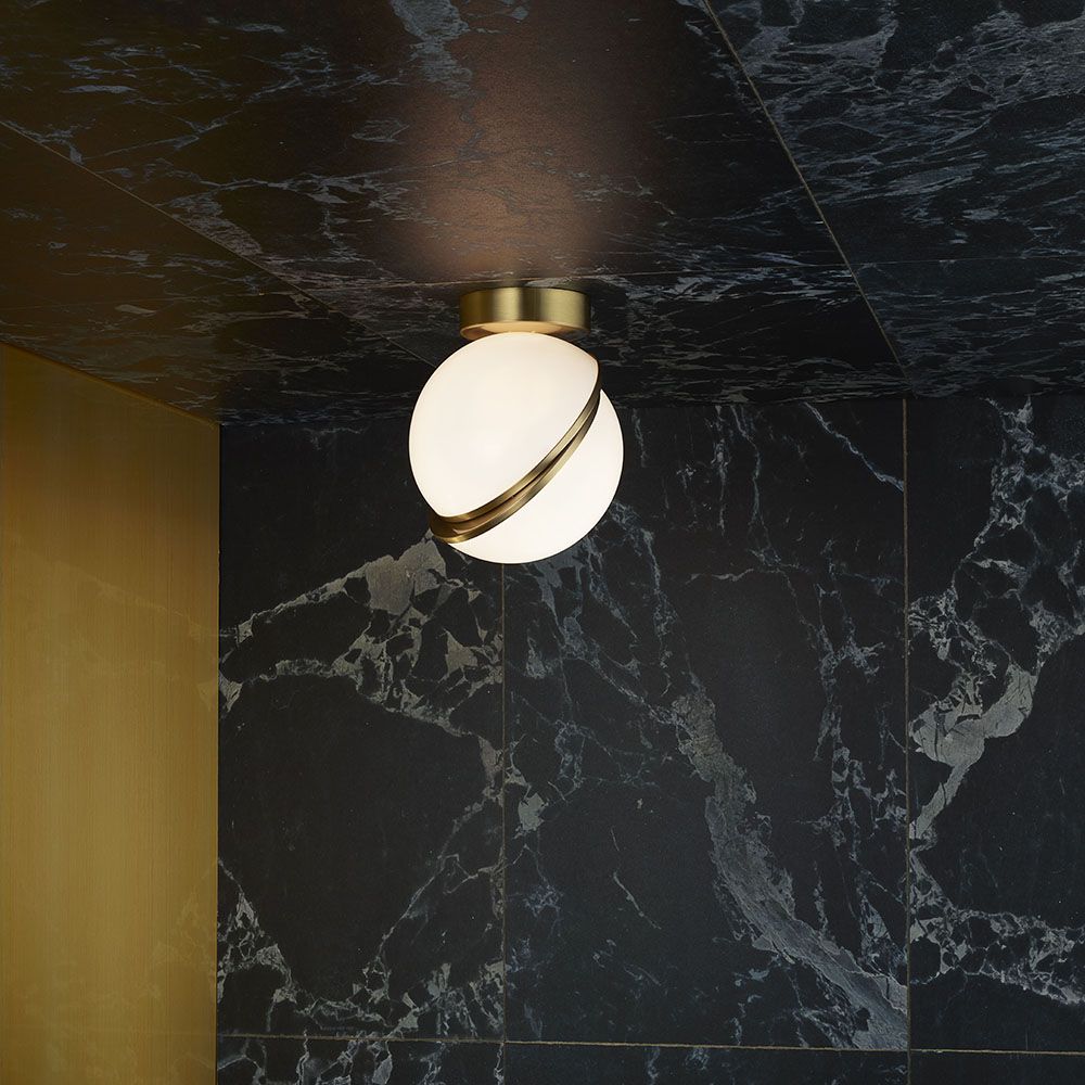 CRESCENT ceiling lamp with an opal shade and brass accents.