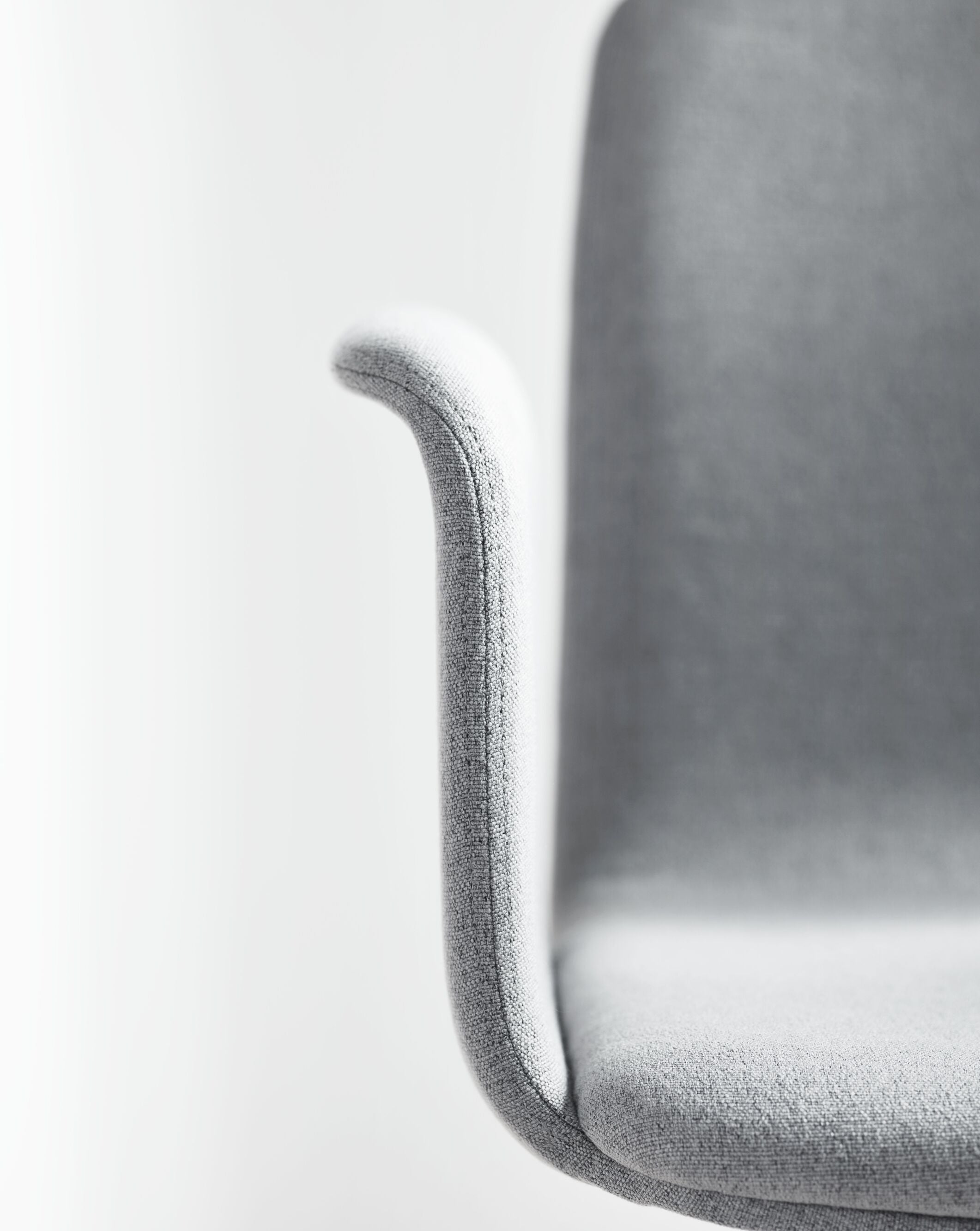 Office armchair with palm armrests upholstered with a metal base