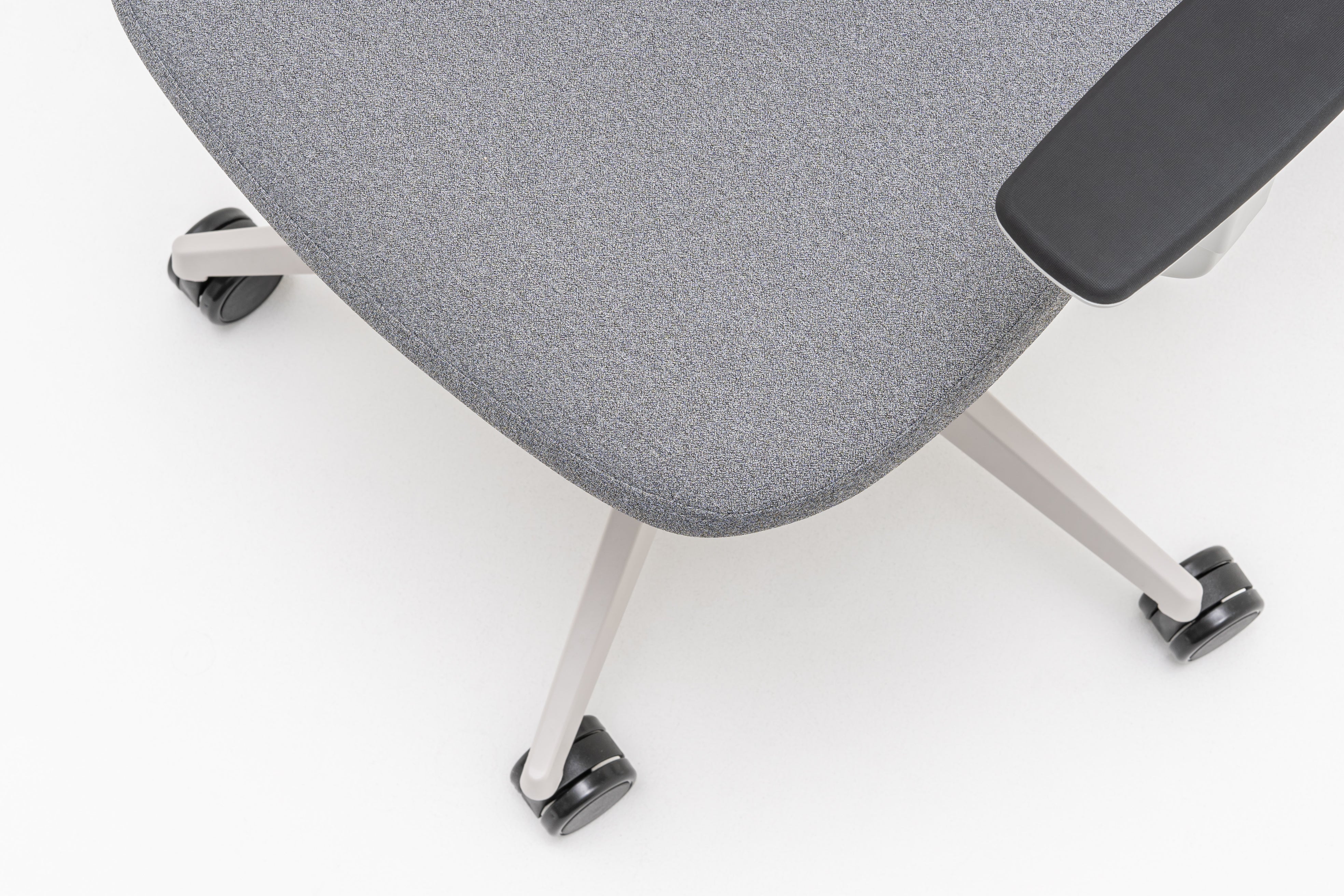 Armchair with an openwork EVO backrest adjustable base with wheels to the soft surface