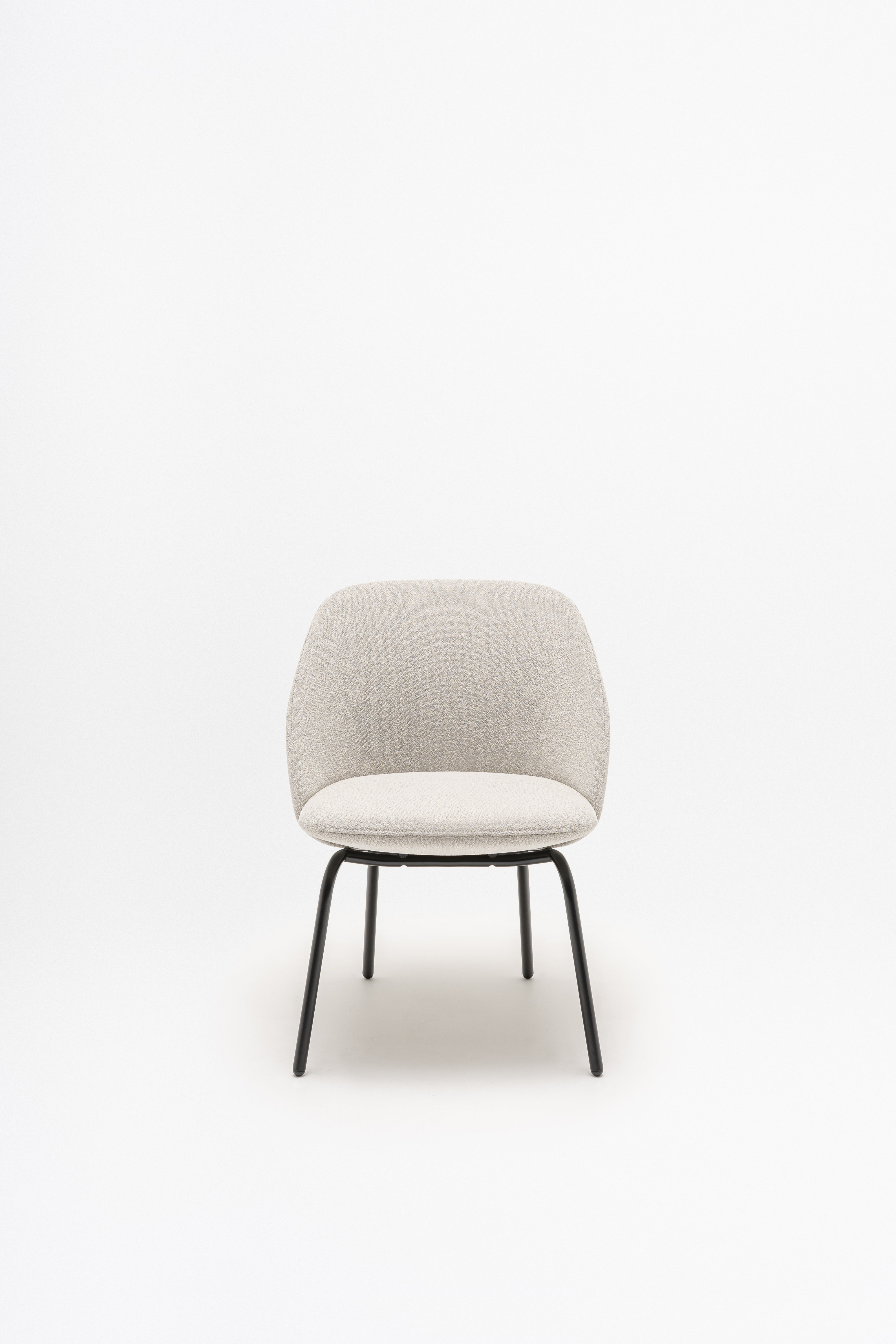 Armchair with low backrest parallel four -legged base